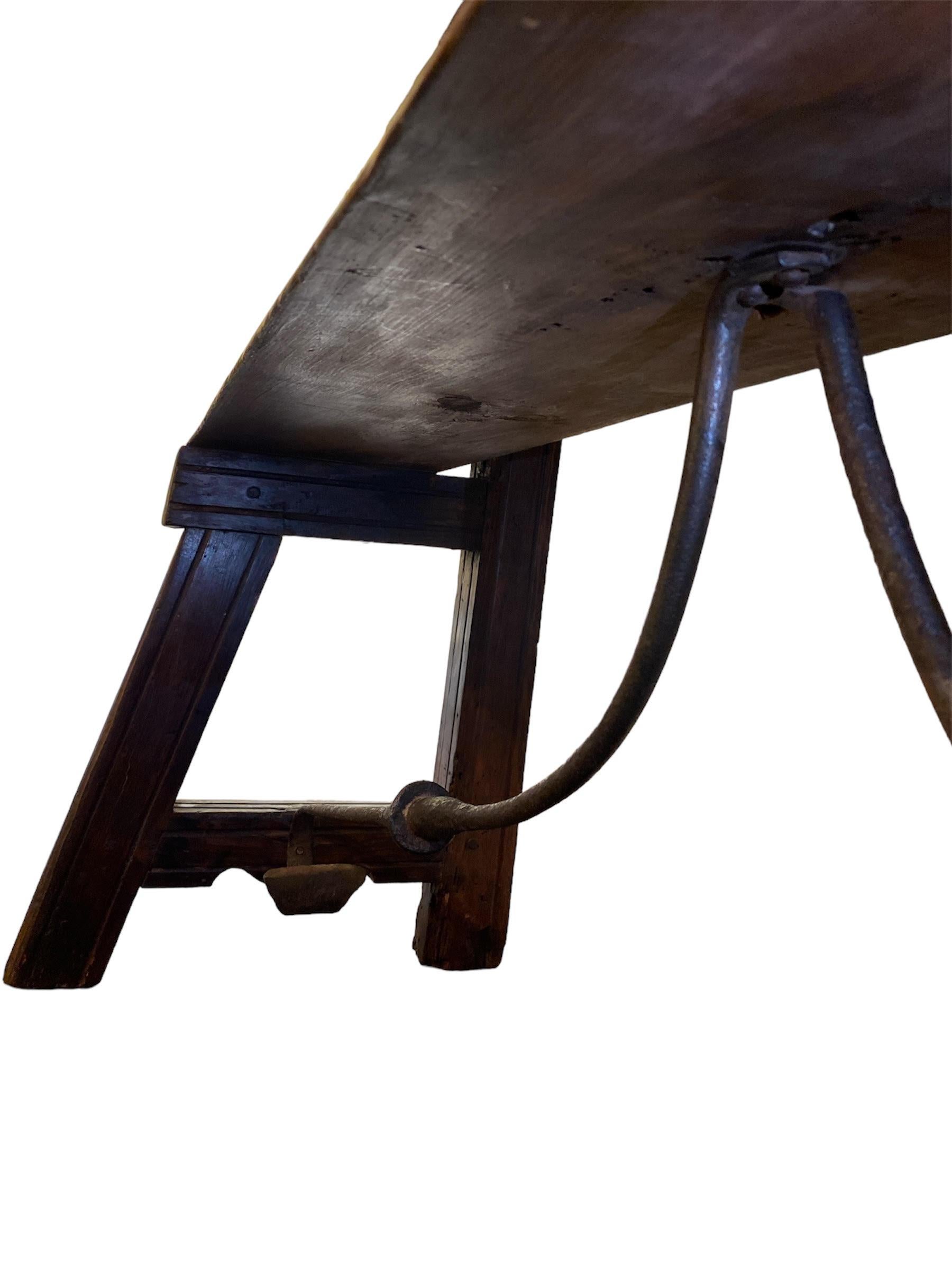 18th c, Spanish Revival wood Bench hand wrought Iron  stretcher. In Excellent Condition In Pasadena, CA