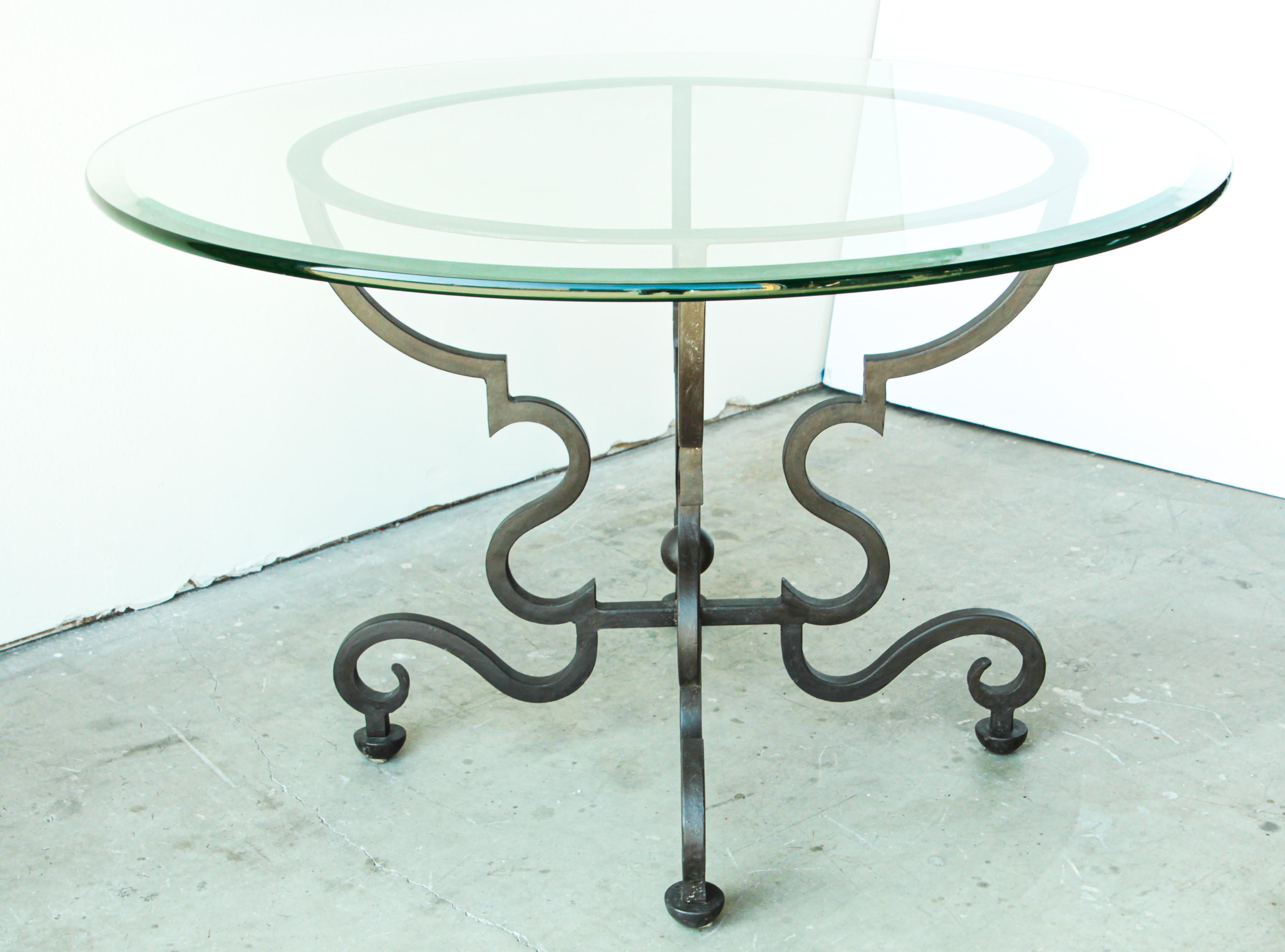 Impressive Spanish round dining table wrought iron base with heavy thick featuring decorative scrolled legs and feet. Heavy iron base with a patinated iron rust finish.
Great for any Spanish Moorish Mediterranean style garden.
Wrought iron dining