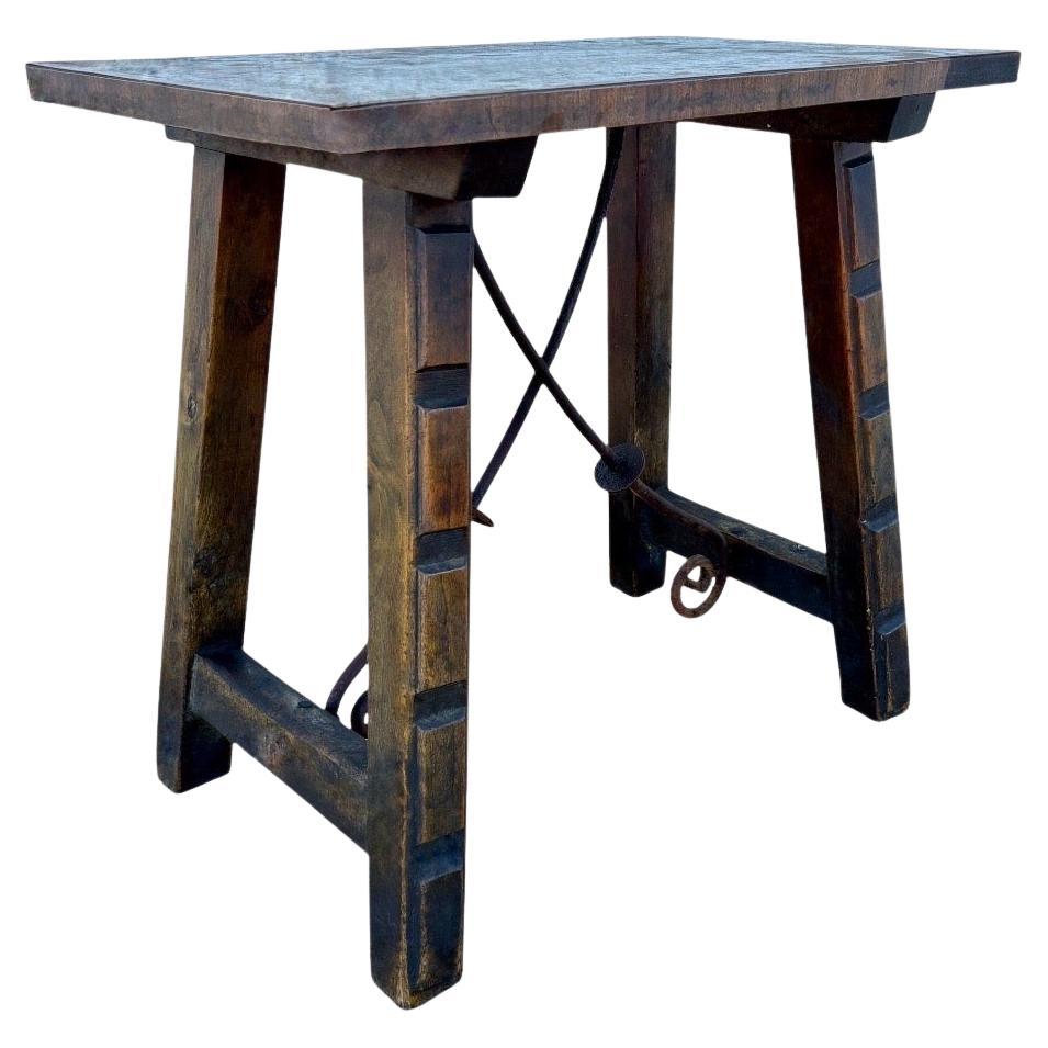 Spanish Rustic Oak Side Table with Hand-Forged Iron Stretcher, c. 1920s For Sale