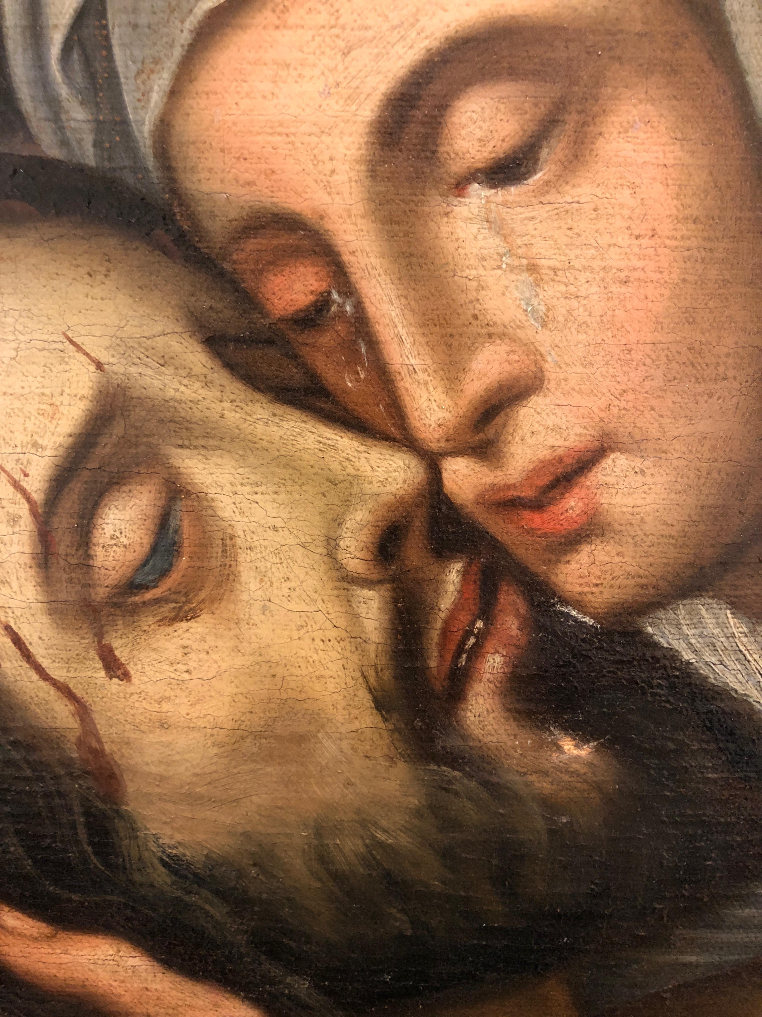 An early 17th century painting in oil on canvas from the Spanish School depicting the Lamentation of Christ.
In this moving depiction of the Lamentation Christ's body has been brought down from the cross. His head is cradled in the arms of his