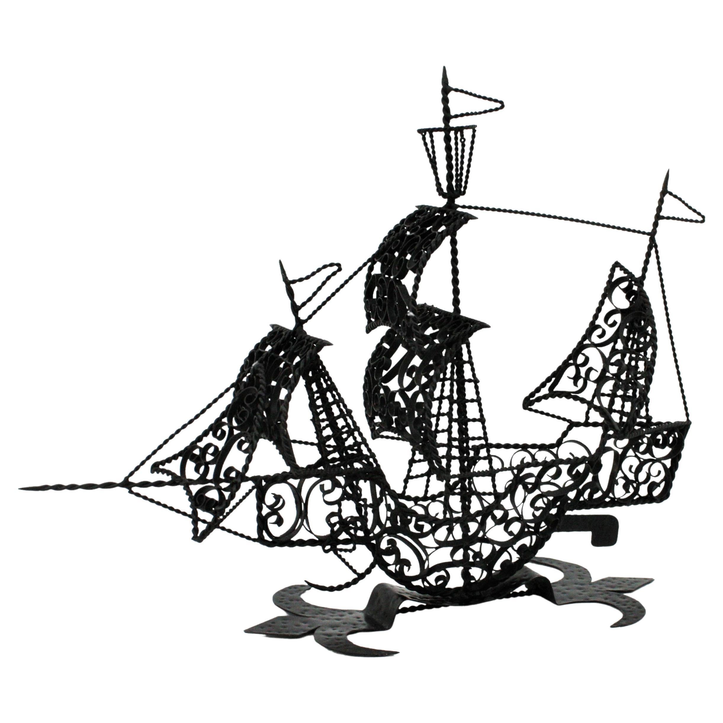 Wrought iron Spanish caravel boat / galleon sculpture. Spain, 1940s-1950s
This sailing ship sculpture was handcrafted in Spain at the mid-20th century period. The ship has a richly detailed scrollwork, iron work with twisted wires. It stands up on a