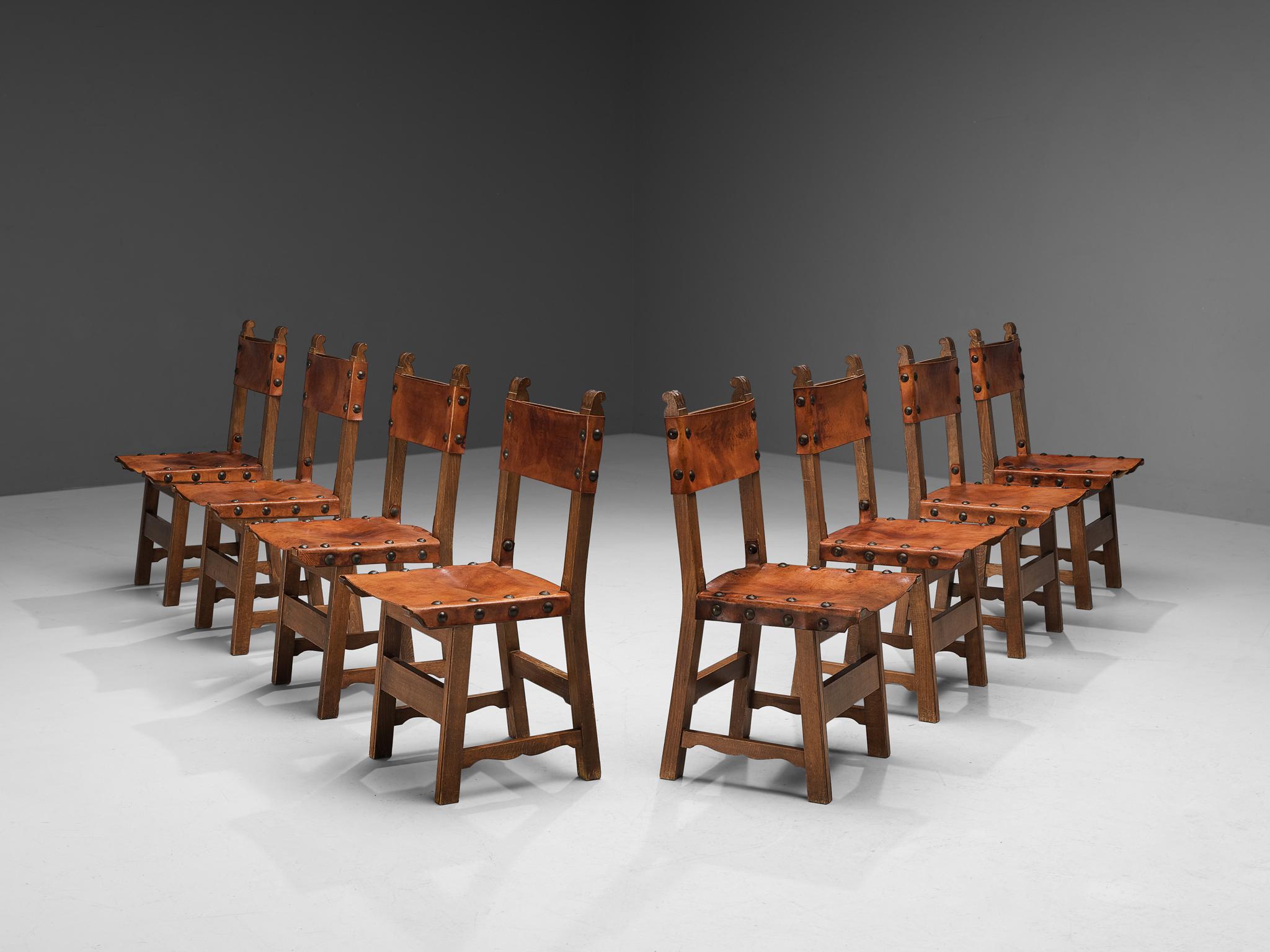 Dining chairs, saddle leather, oak, metal, Spain, 1960s

This set of eight Spanish dining chairs has a rustic yet distinct design. The beautiful oak wooden frame shows clear lines and an elegant organic touch is visible in the lower stretcher