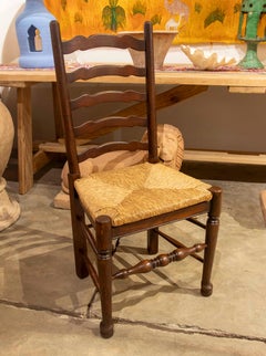 Juego español de seis sillas de madera con asiento de enea