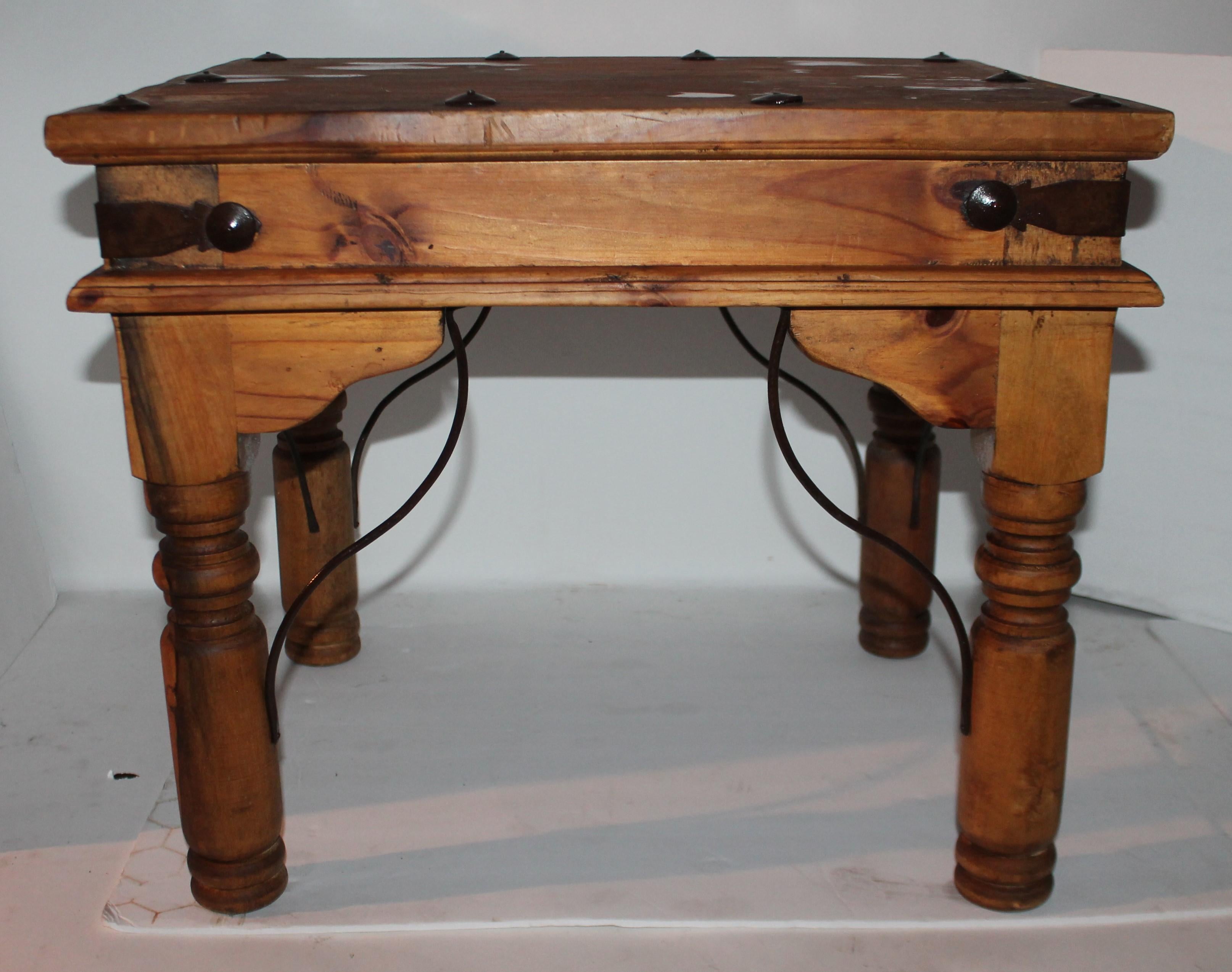 This very cool small end table is from Mexico and is signed underneath the top and is in very sturdy condition. Could work as a child's gaming table. It is super strong and sturdy.