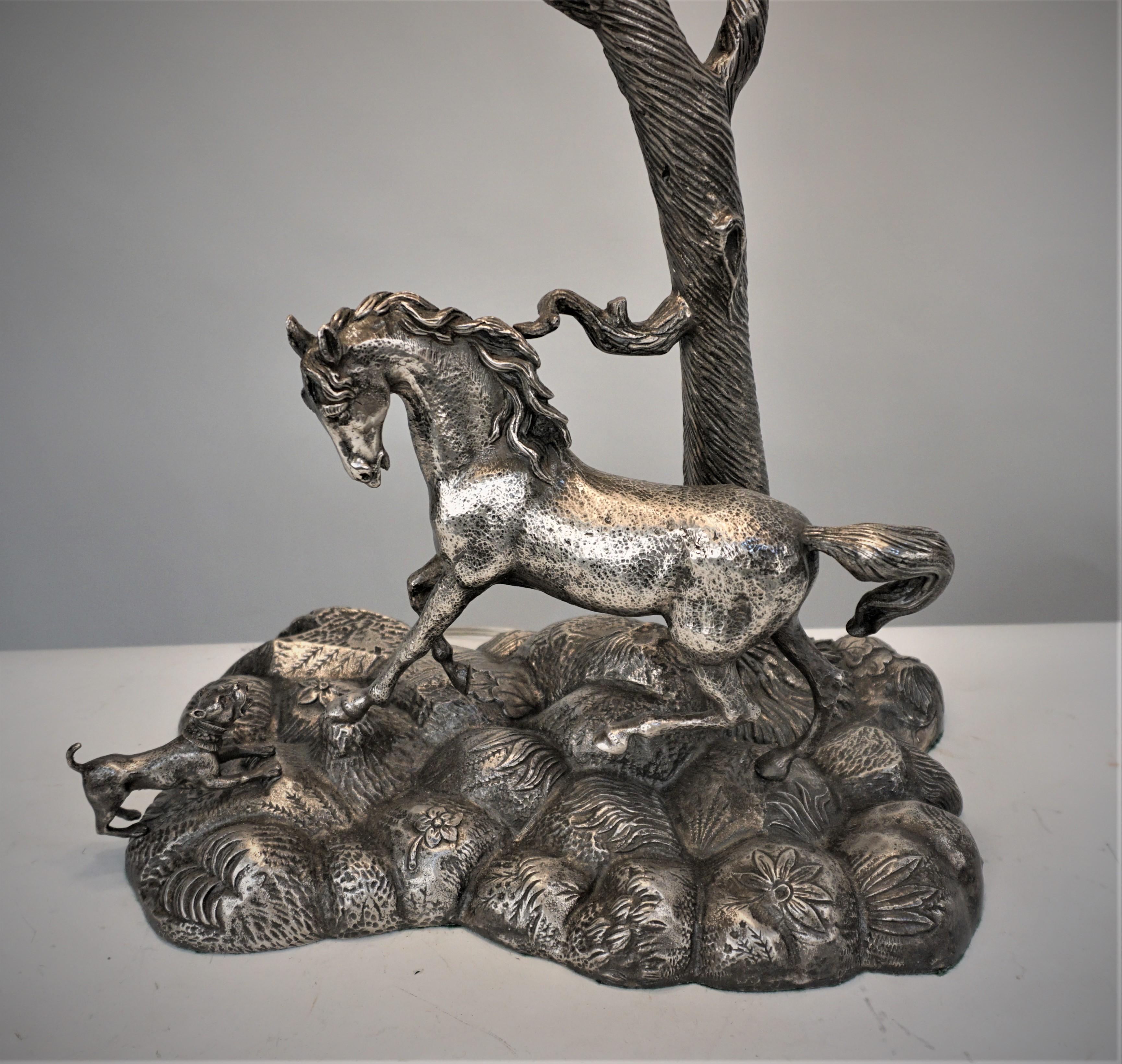 Elegant horse and a dog silver on bronze sculpture double socket table lamp with pleated lampshade. 
Measurement includes the shade.