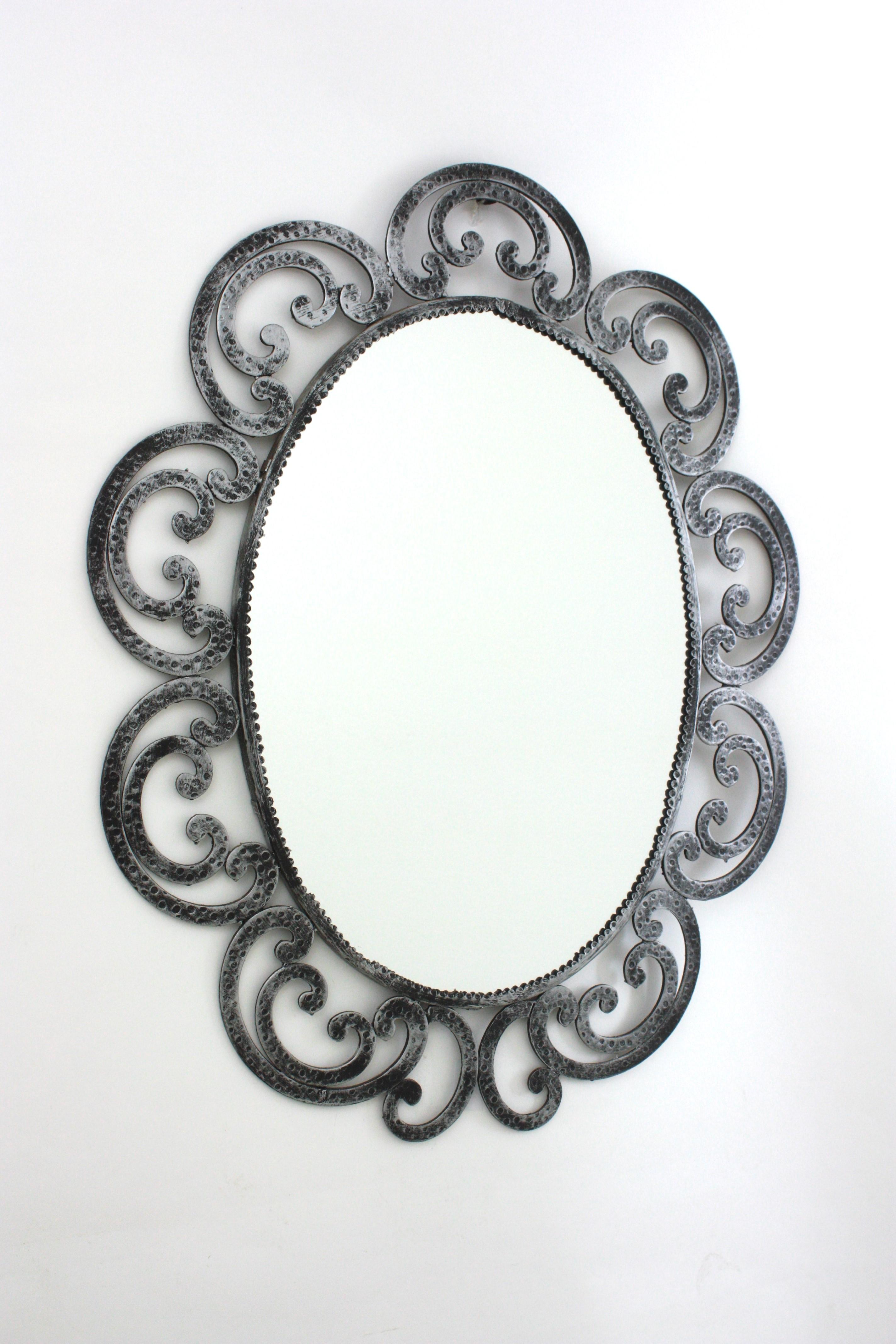 Brutalist Spanish Silvered Flower Sunburst Oval Mirror in Wrought Iron, 1950s For Sale
