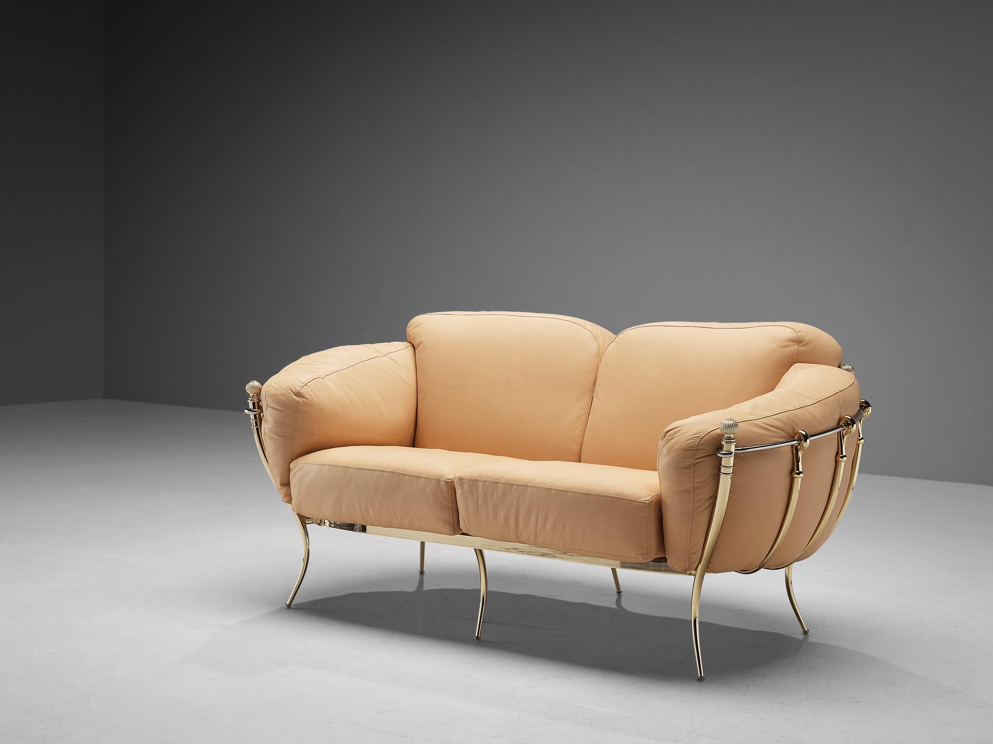 Sofa, leather, brass, metal, Spain, 1980s

A highly delicate canapé with voluminous shapes and eccentric decorations. The brass frame is composed of curved tubes that are beautifully bent at the ends. Four outer legs resemble pillars with spherical