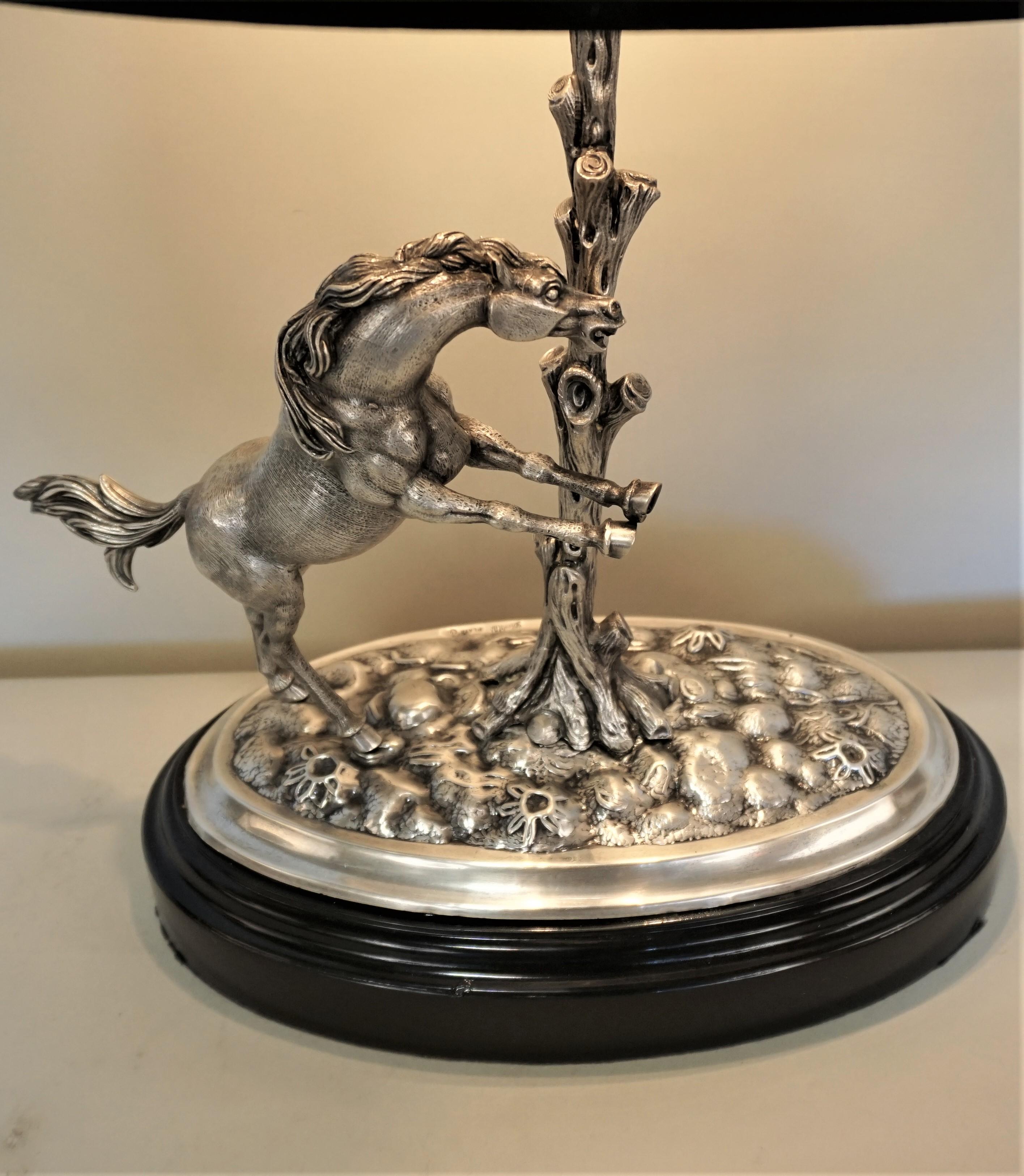 Sterling silver sculpture of a horse that has been modified as a table lamp
(Silver Gena Manufacturas De Orfebreria, S.A. Calle Provenza, 260 Barcelona).