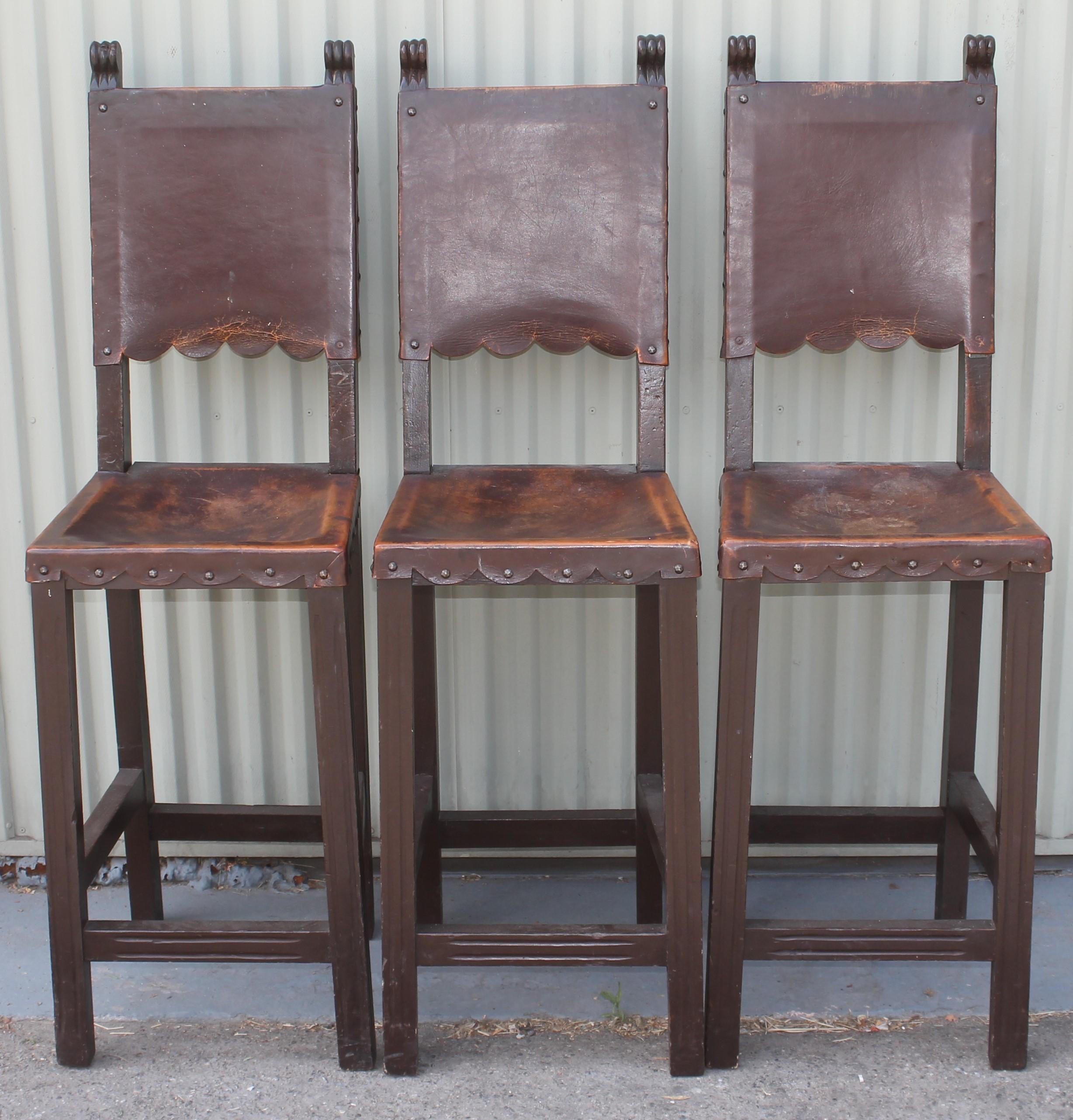 Set of three Spanish style bar stools in very good condition with original leather seats. The patina on the original seats and backs are amazing. Its very rare to find the original leather in such great condition.
(Seat height measures 28 inches).