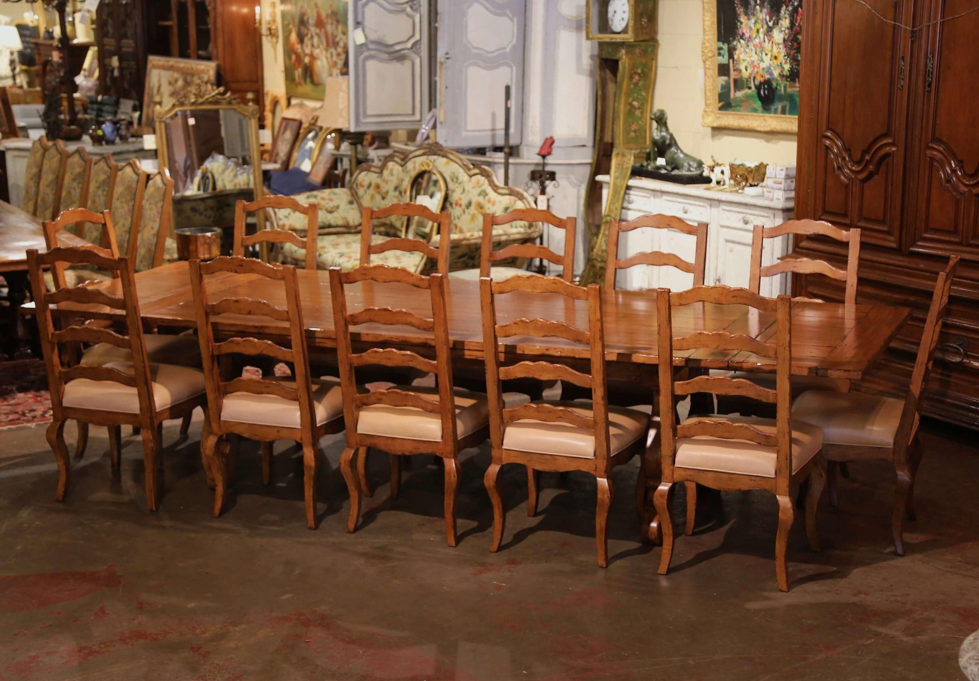 Spanish Style Carved Walnut Refectory Trestle Dining Table and 12 Leather Chairs In Excellent Condition In Dallas, TX