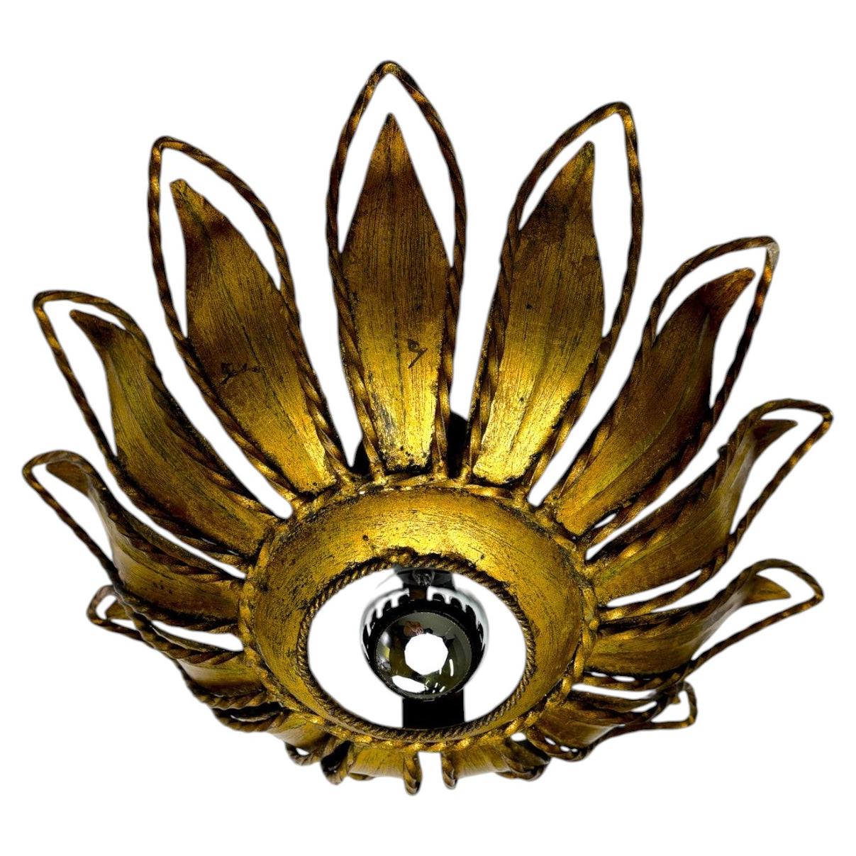 Spanish Sunburst ceiling light fixture or sconce in Gilt Iron, Circa 1960 For Sale