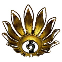 Spanish Sunburst ceiling light fixture or sconce in Gilt Iron, Circa 1960