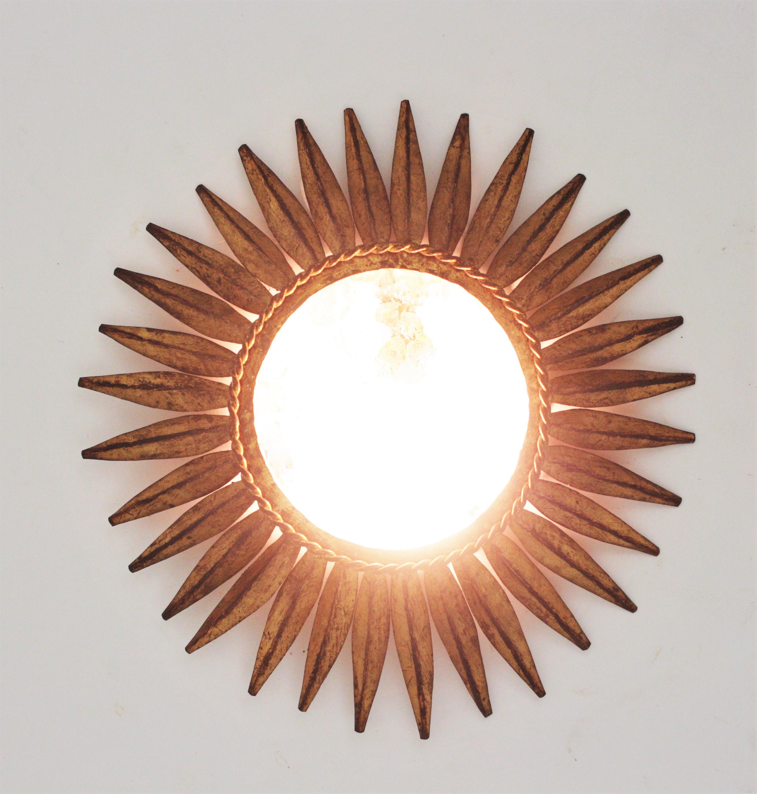 20th Century Spanish Sunburst Crown Ceiling Light Fixture, Gilt Iron and Textured Glass For Sale