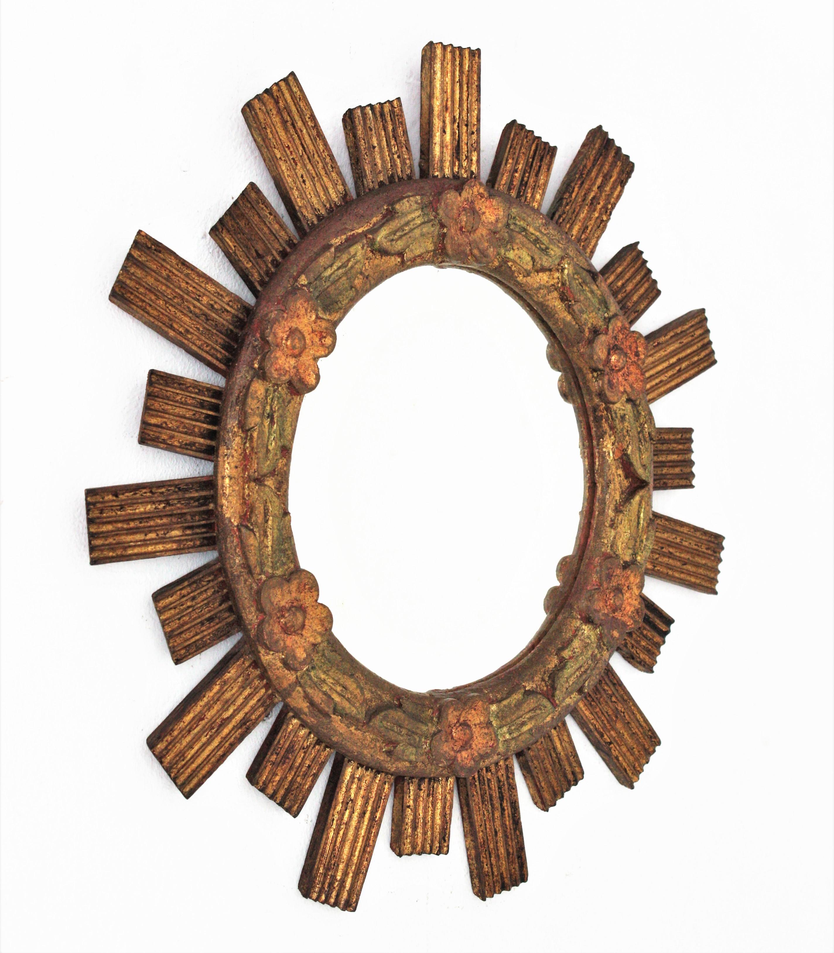 Mid-Century Modern Spanish Sunburst Giltwood Mirror with Flower Details For Sale