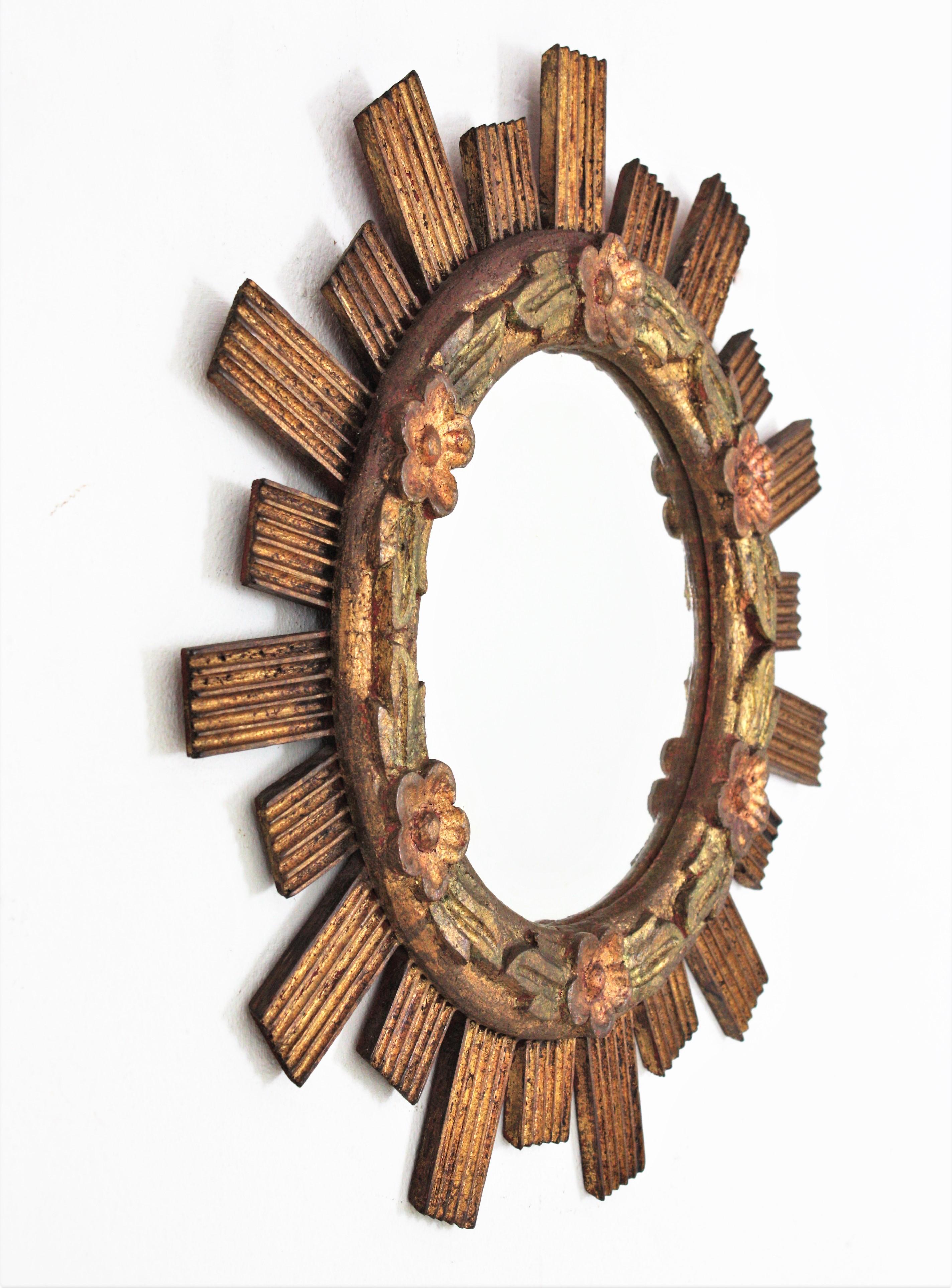 Polychromed Spanish Sunburst Giltwood Mirror with Flower Details For Sale