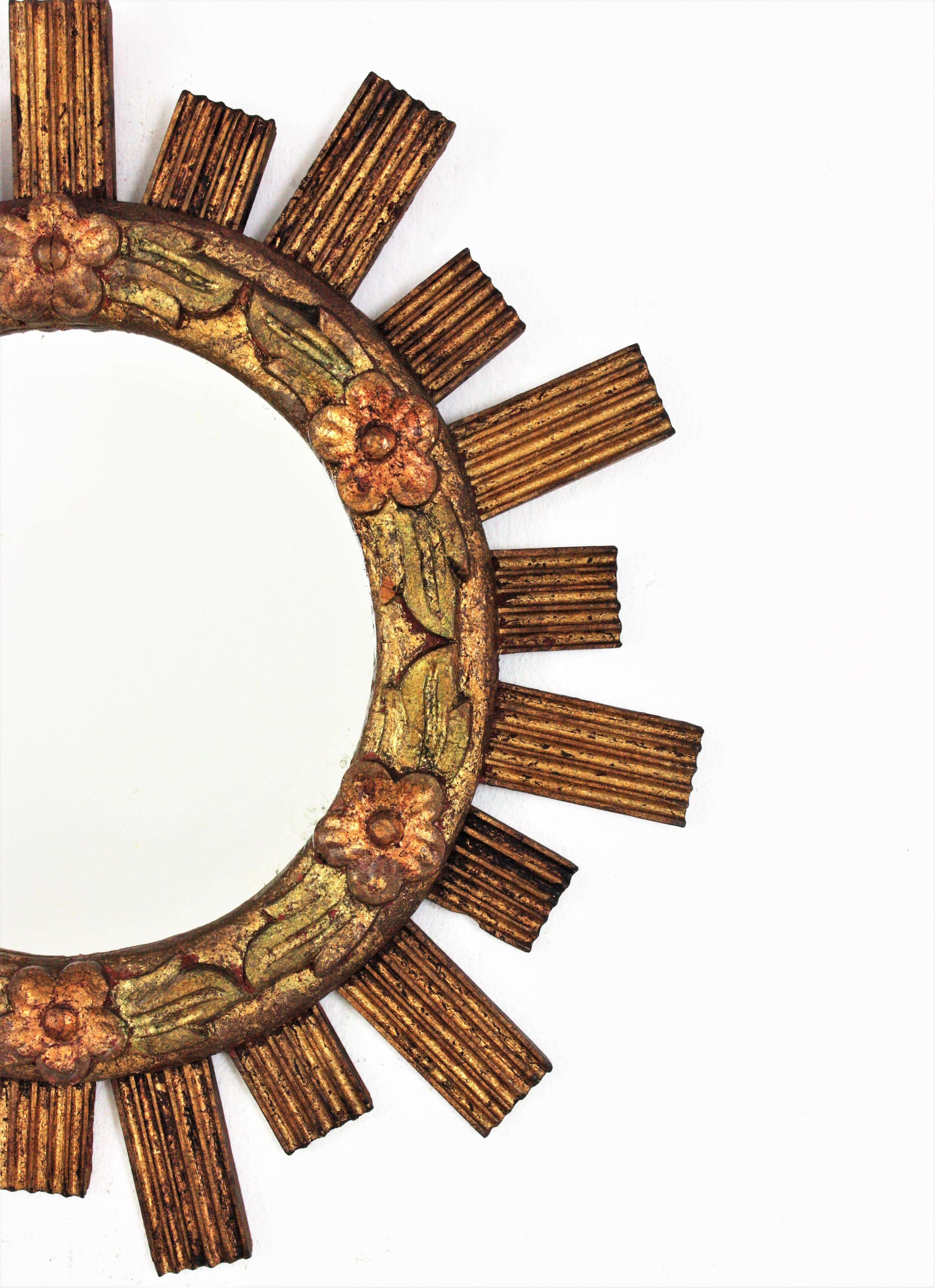 20th Century Spanish Sunburst Giltwood Mirror with Flower Details For Sale