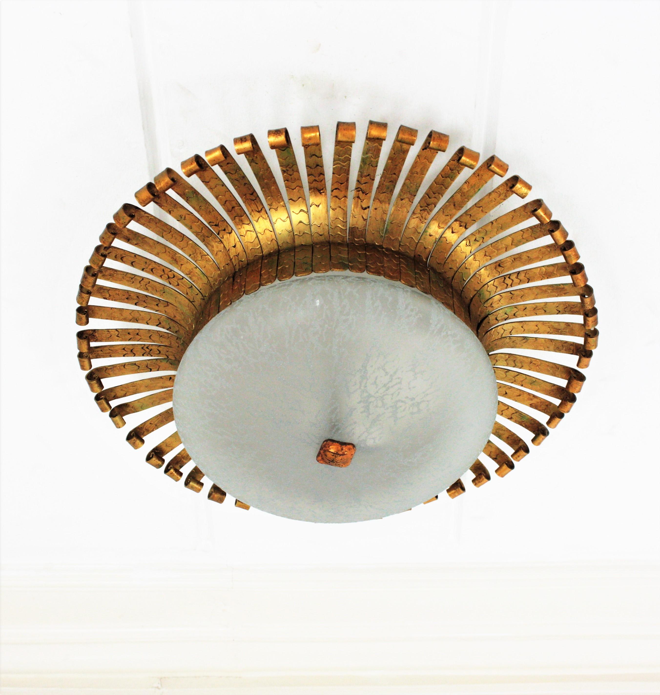 Spanish Sunburst Light Fixture in Wrought Gilt Iron with Frosted Glass Shade In Good Condition For Sale In Barcelona, ES