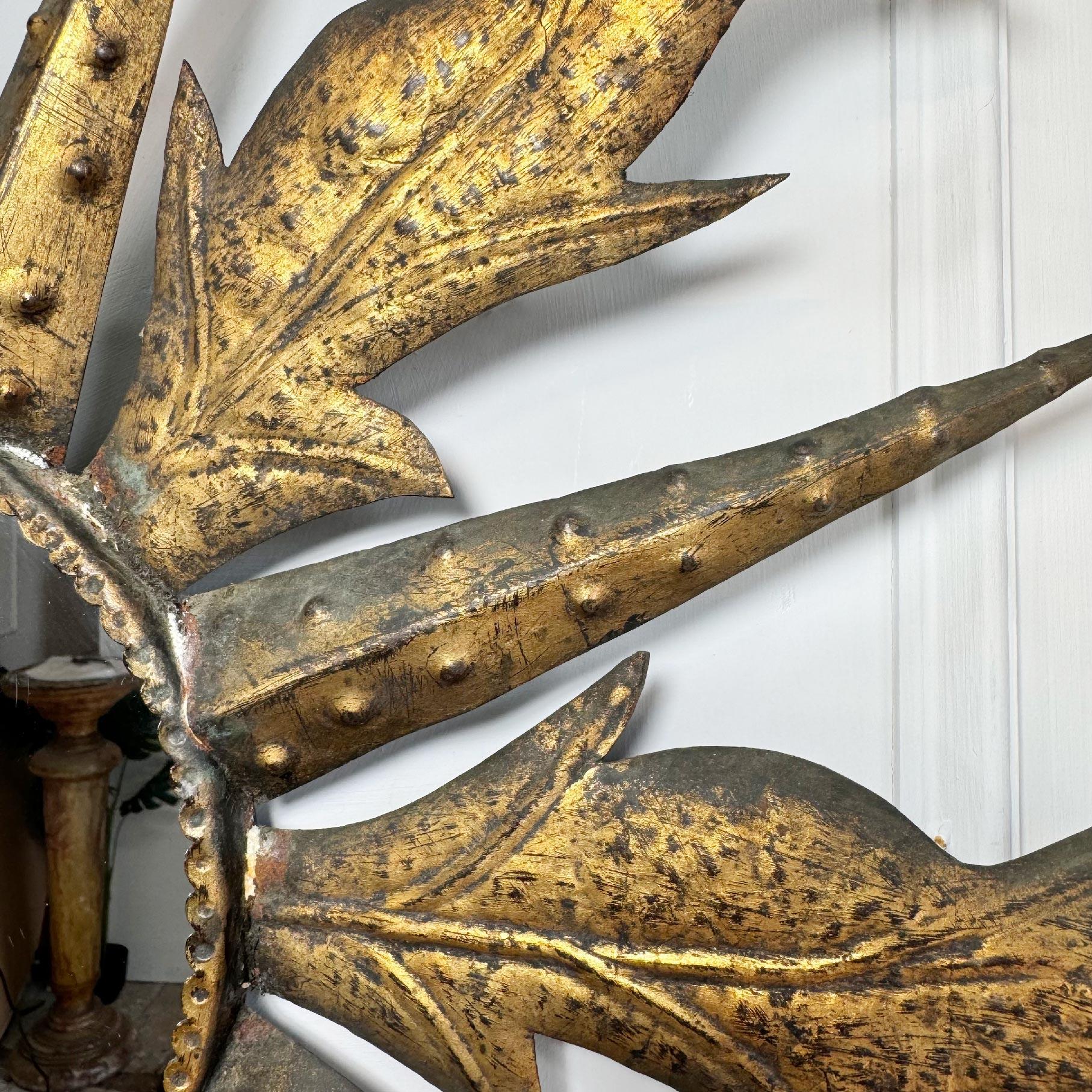 A fabulous example of an iron gilt Spanish sunburst mirror, circa 1950's. The golden sunburst rays, each individually crafted and of unusual deign and superbly detail emanate from the central circular mirror plate.

 
The original mirror plate