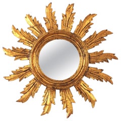 Specchio spagnolo a raggiera in legno dorato intagliato, anni '50
