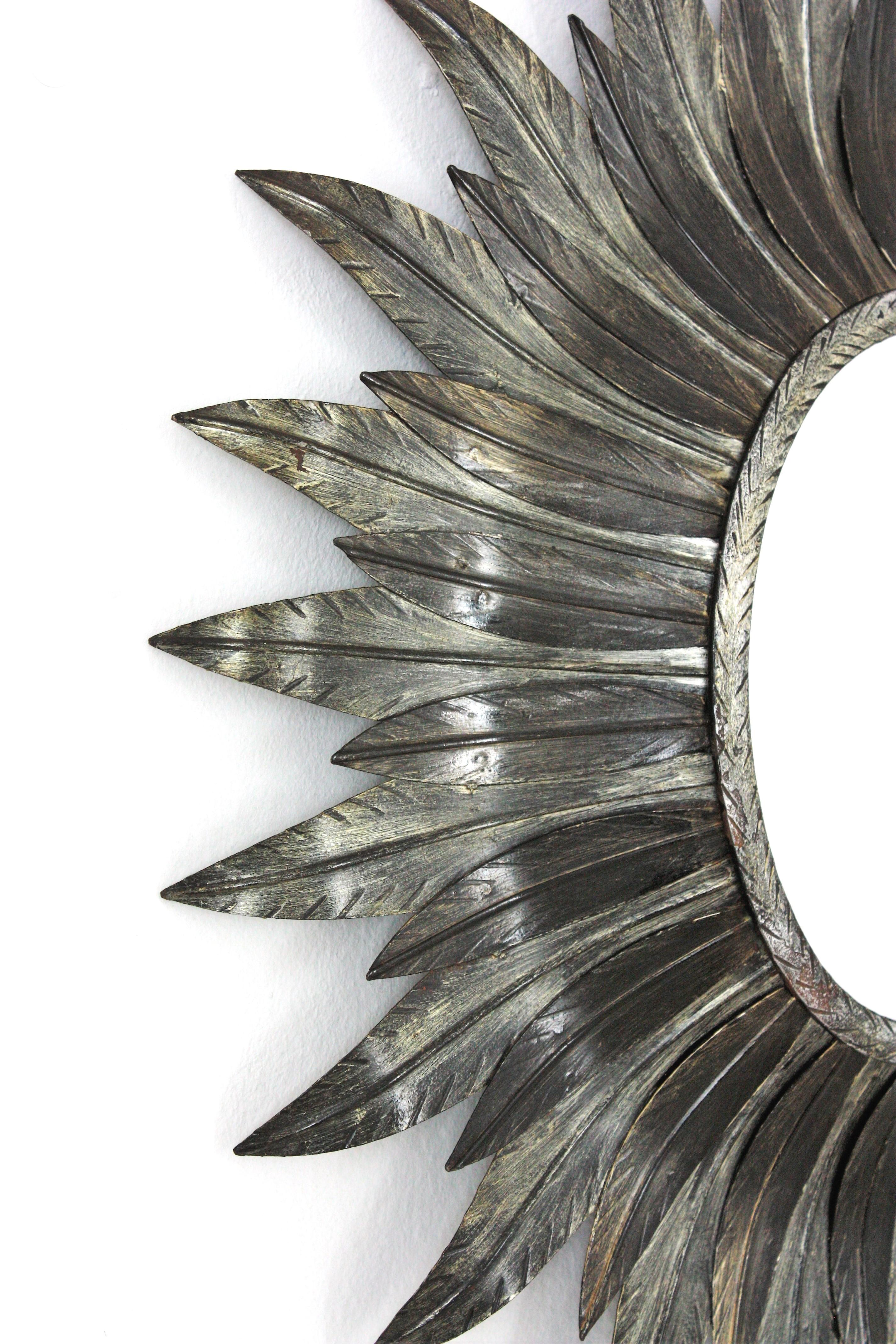 Gilt Spanish Sunburst Oval Leafed Mirror in Silvered Metal For Sale