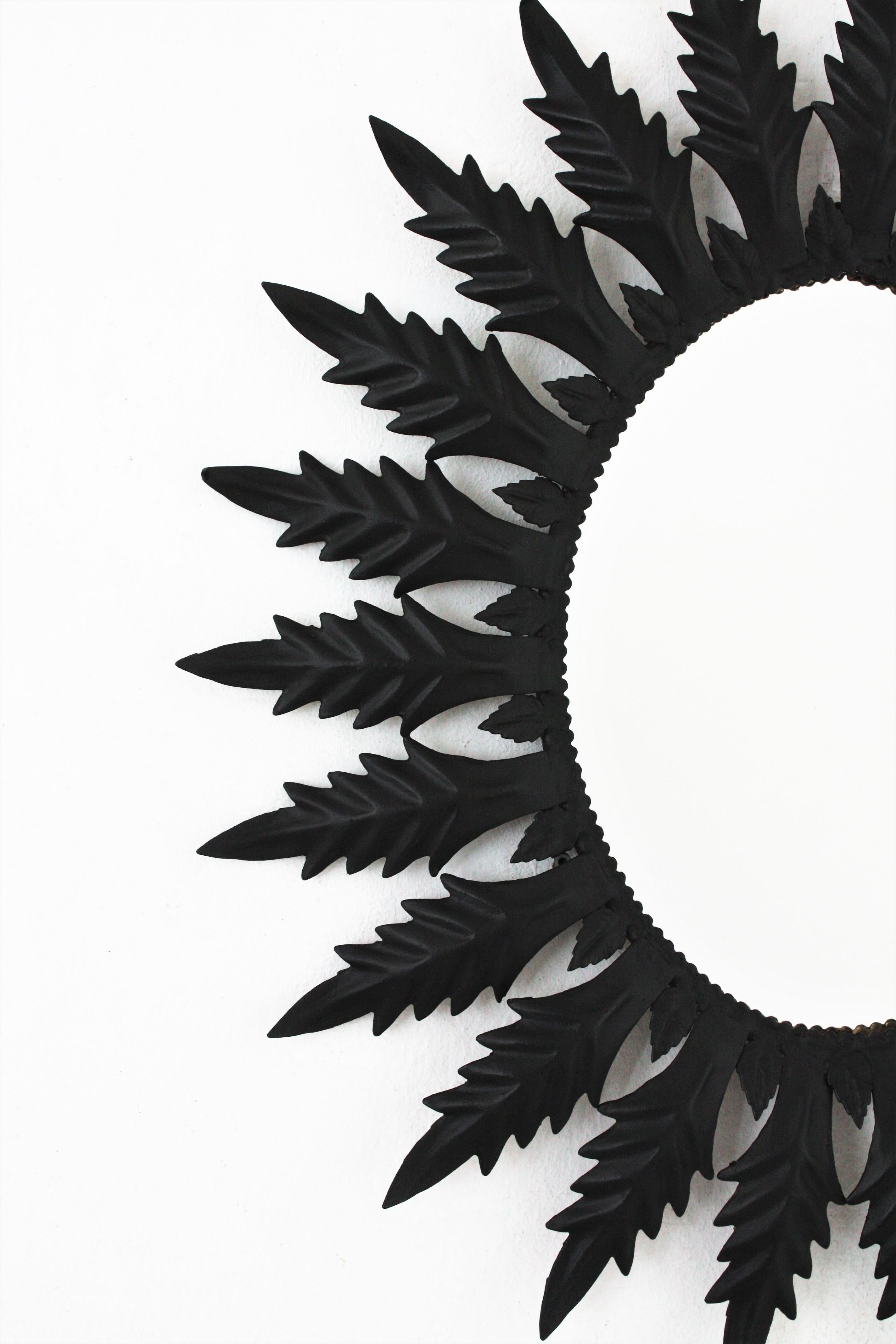 Spanish Sunburst Oval Mirror in Black Painted Iron, 1960s In Good Condition For Sale In Barcelona, ES