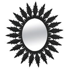 Sunburst Black Painted Iron Oval Mirror from Spain, 1960s