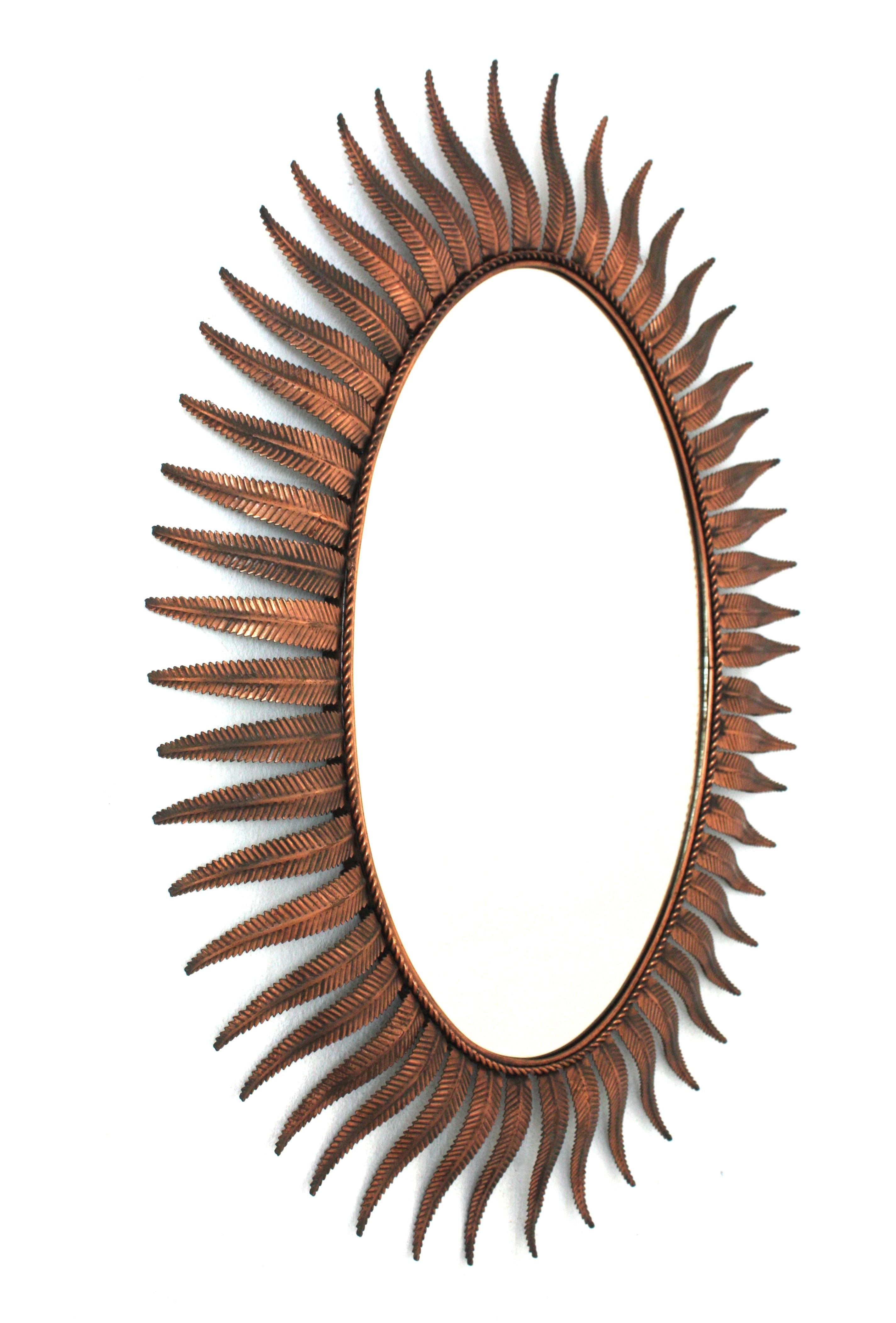 Hammered Spanish Sunburst Oval Mirror in Copper Metal, 1950s For Sale