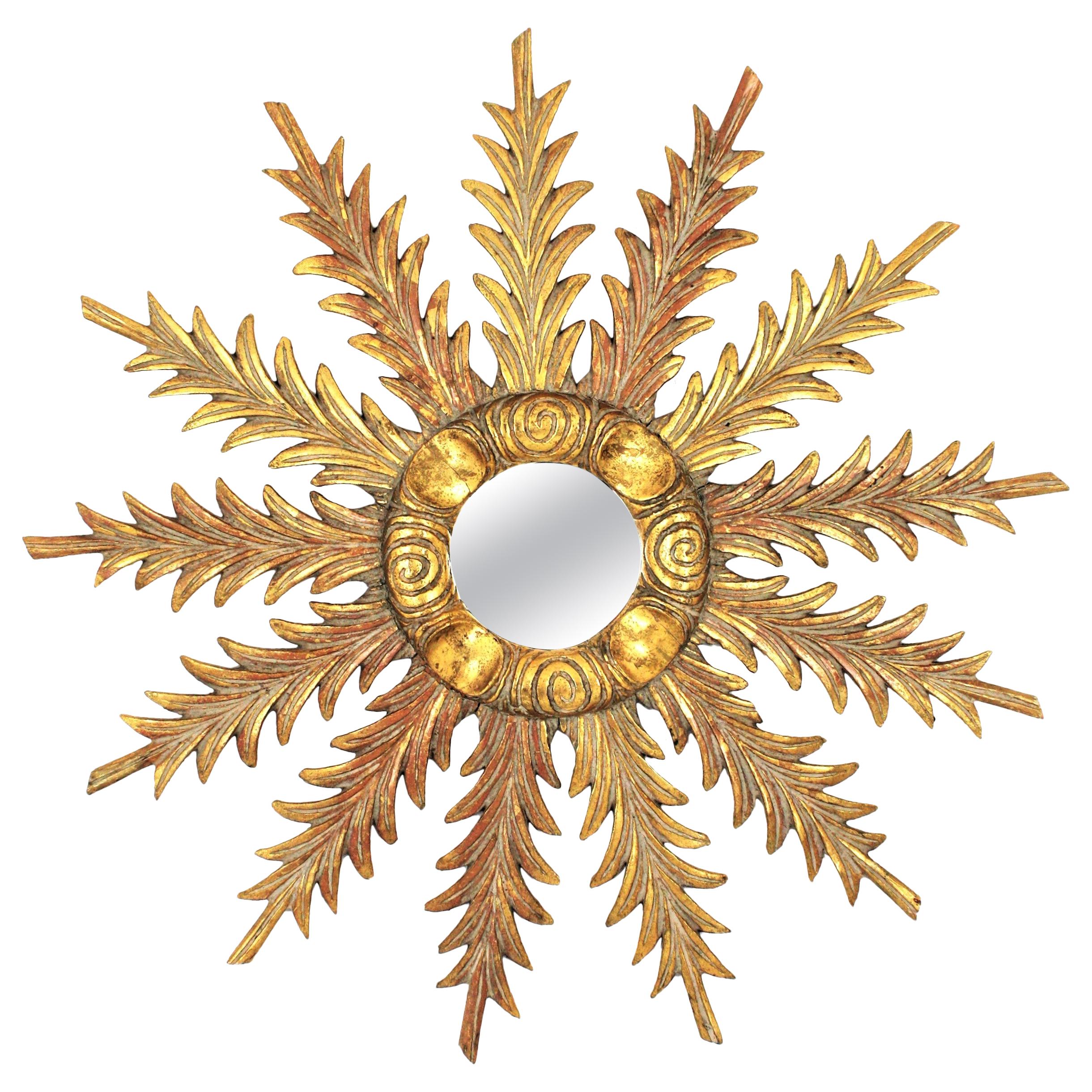 Hollywood Regency Sunburst Starburst Giltwood Mirror with Foliage Carvings, 1940s For Sale