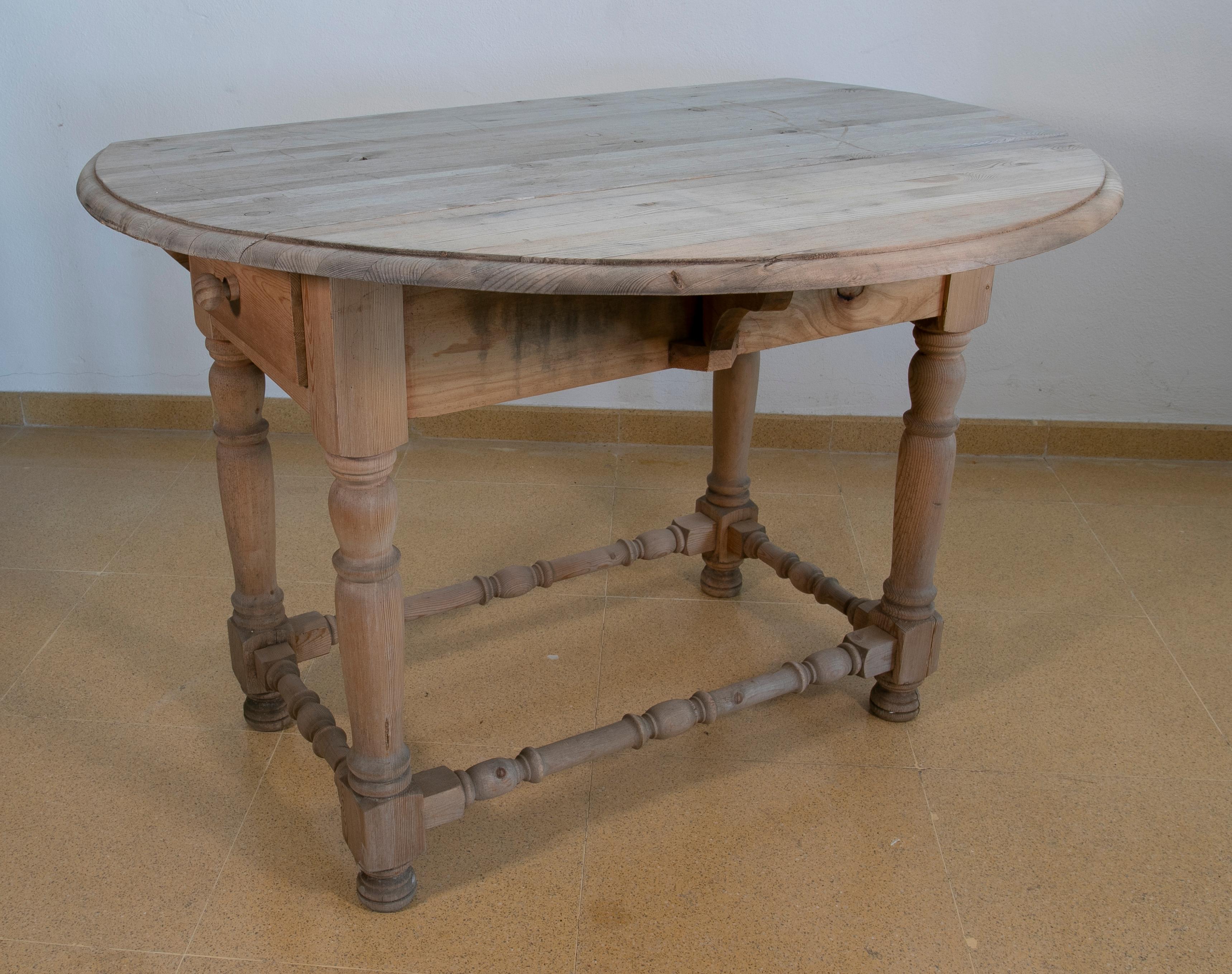 Spanish table with pine wooden wings and drawers
The dimensions are with the table open.
 