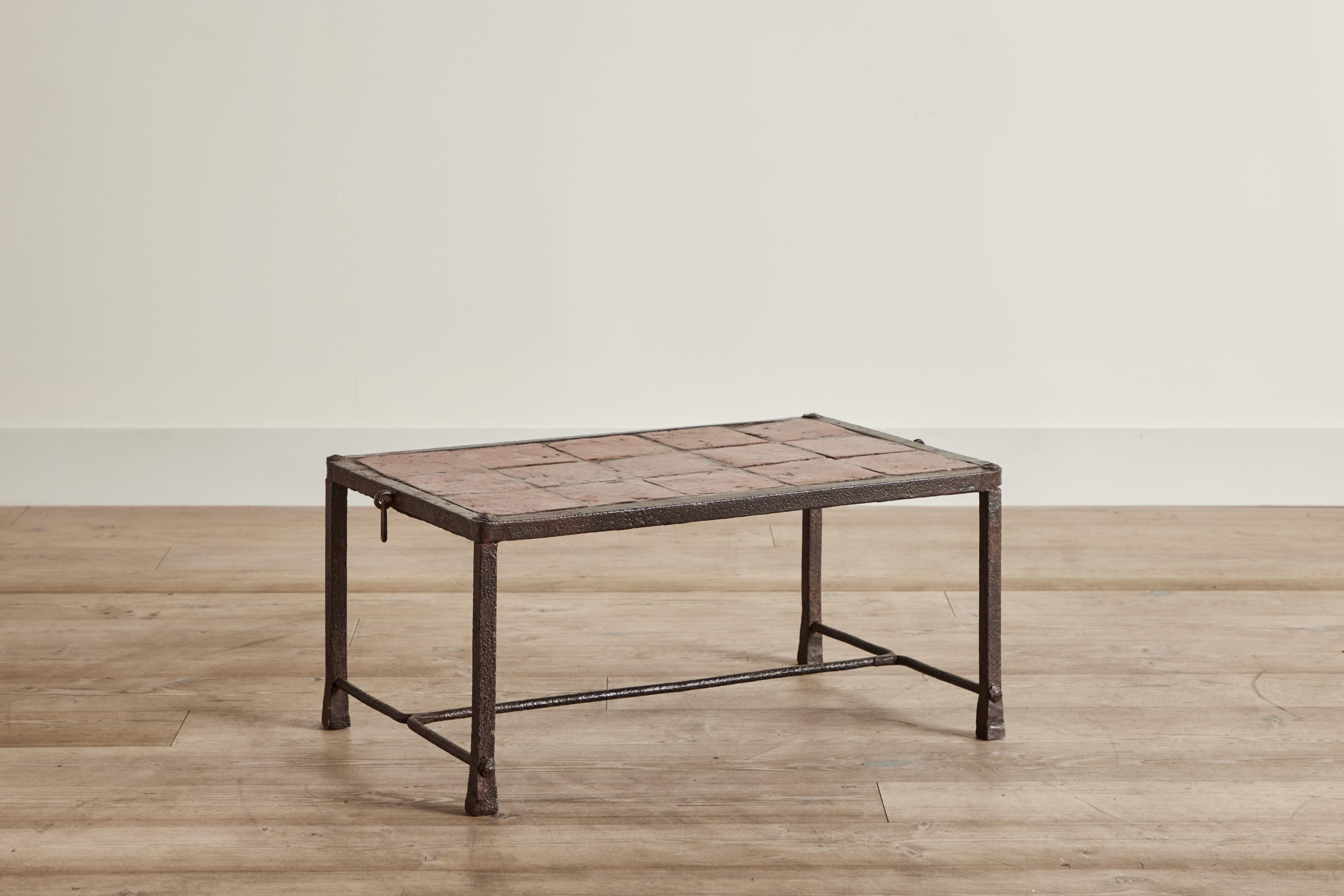  Iron and tile coffee table from Spain circa 1920. Some wear on metal and tile is consistent with age and use. 