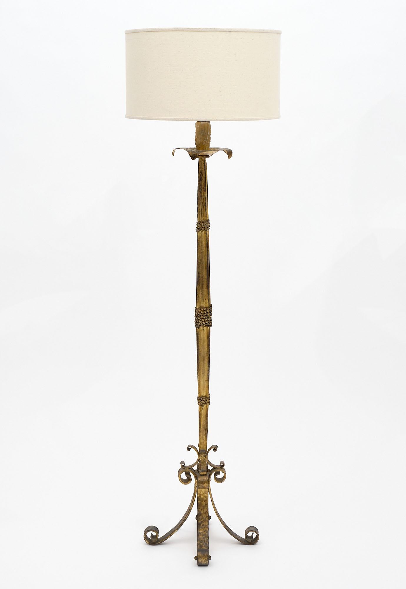 A wonderful Spanish floor lamp; circa 1930. Made of gold leafed; forged iron and rewired for the United States. In excellent condition.