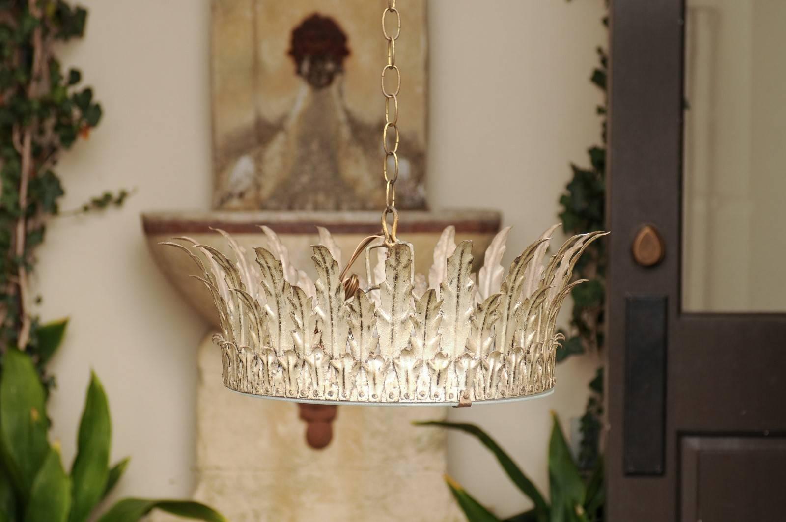 A vintage Spanish silver gilt metal crown three-light light fixture from the mid-20th century with foliage décor and frosted glass. Born during the 1950s-1960s in Spain, this crown light fixture features an exquisite silver gilt metal structure,
