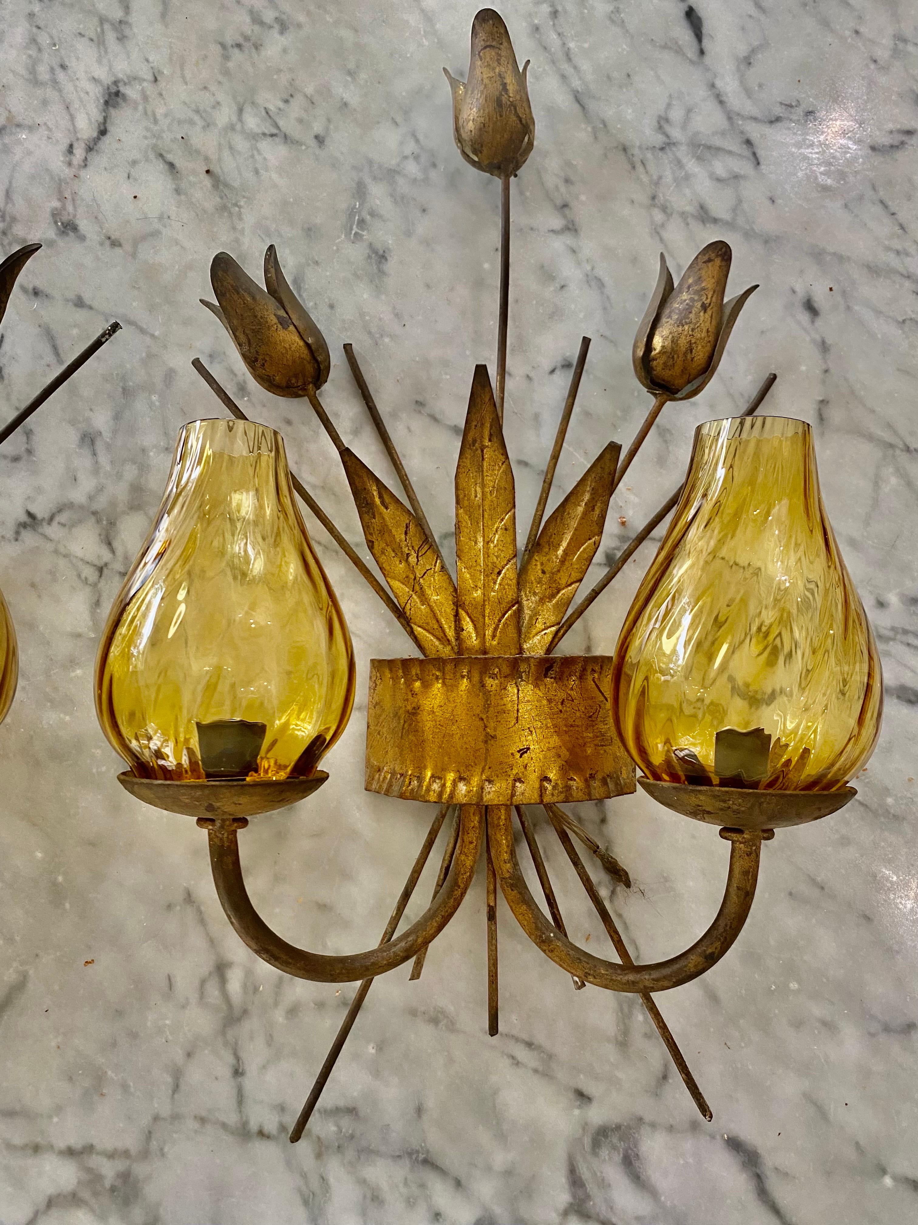 Wonderful old Spanish 1950s two light metal wall sconces with tulip flowers and golden leaves, in a beautiful quirky shape. Traditional handcrafted, Hollywood Regency style. Original wooden candle holders. All parts have been cleaned but without