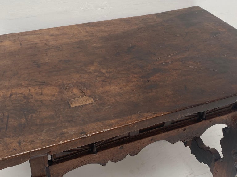 Spanish Walnut Table, Spain, 18 th Century,
one big drawer which contains the originalist iron lock,
nice carvings and metal connections the legs,
one piece table top,
great patina, warm and worn finish of the wood