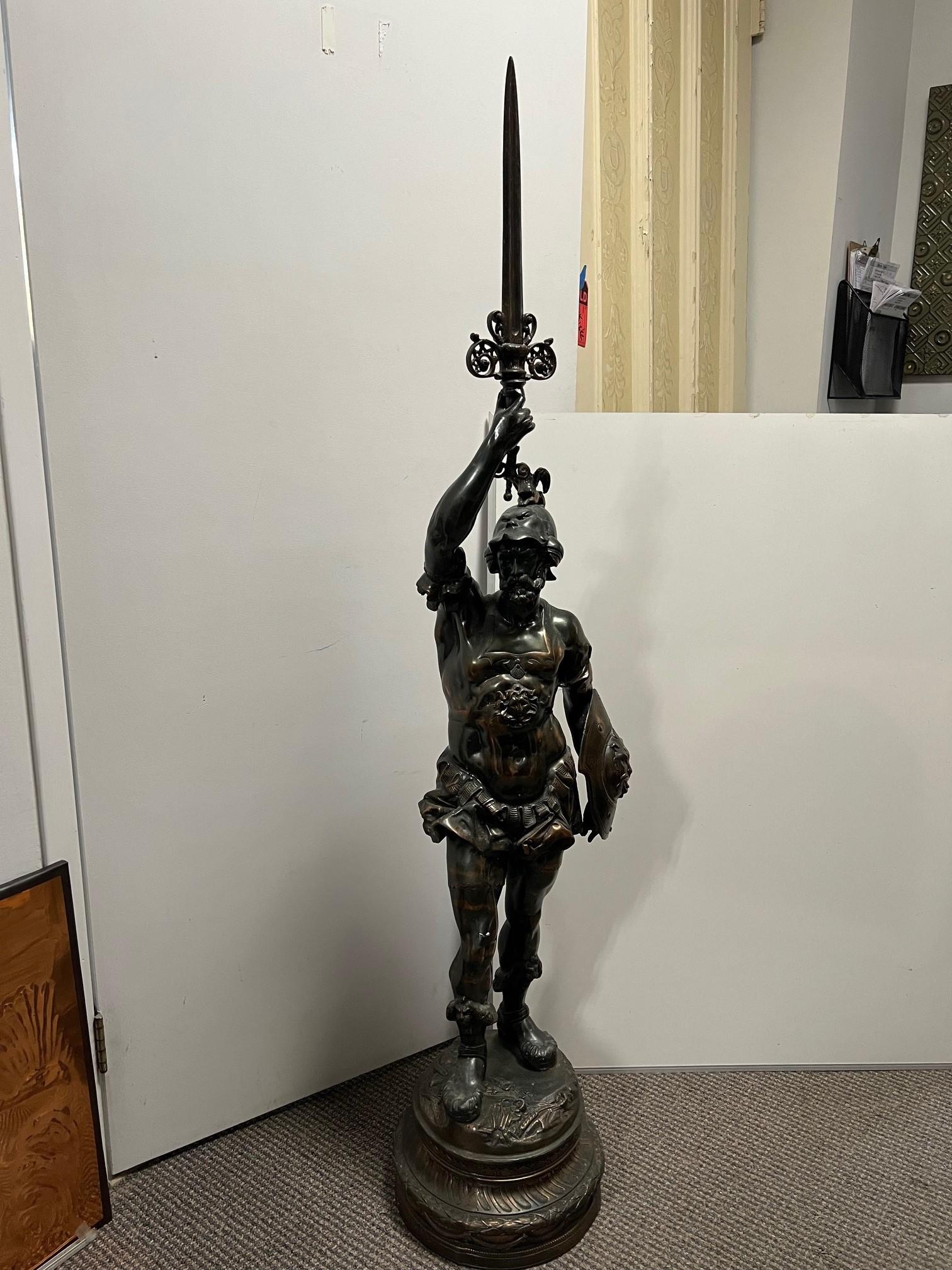 This is a good looking Spanish Warrior or Conquistador holding a sword with a decorative shield. From a private collector who filled his home with beautiful and unique pieces over the years.  It's a good size standing 64