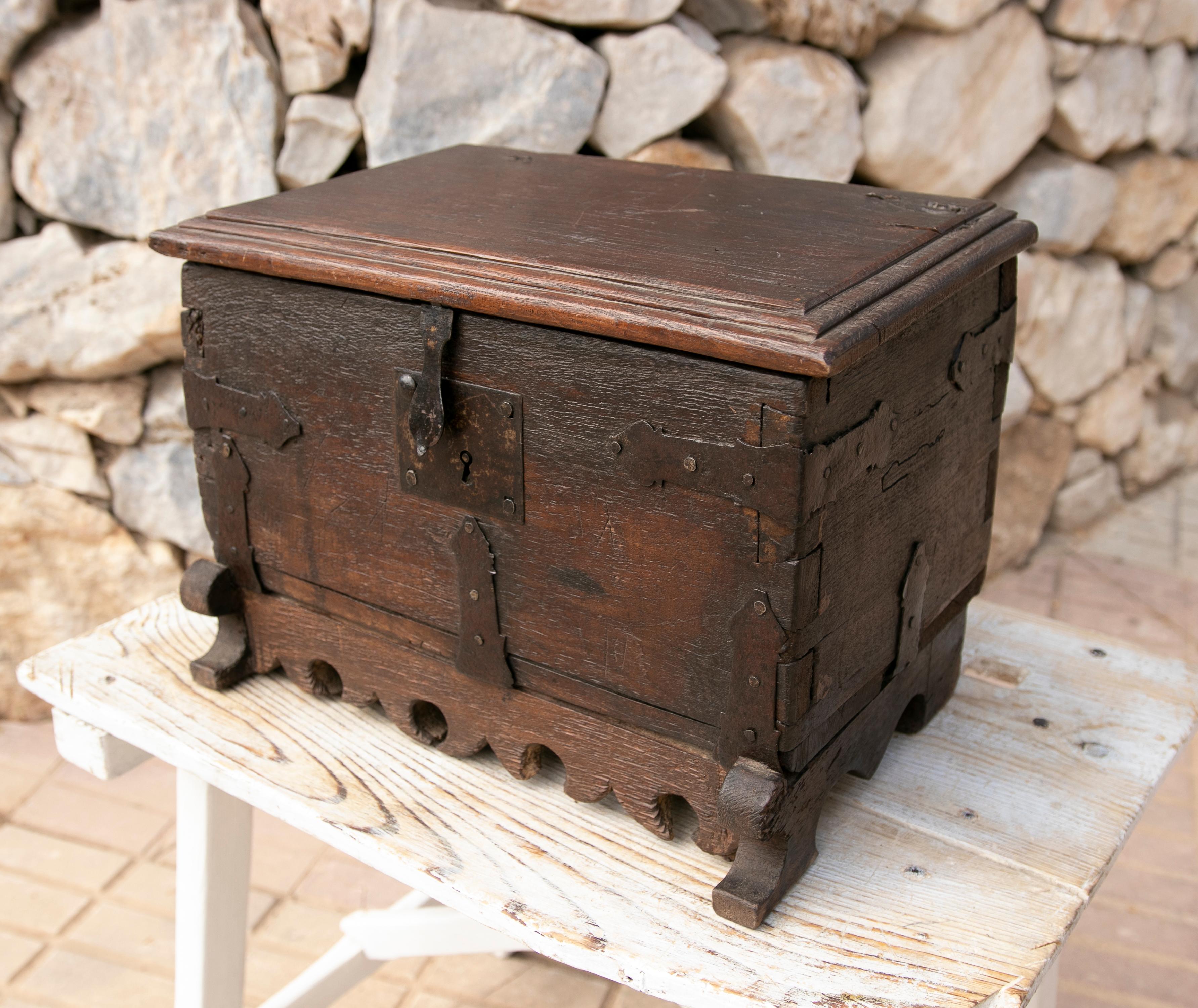Spanish wooden chest with original iron fittings.