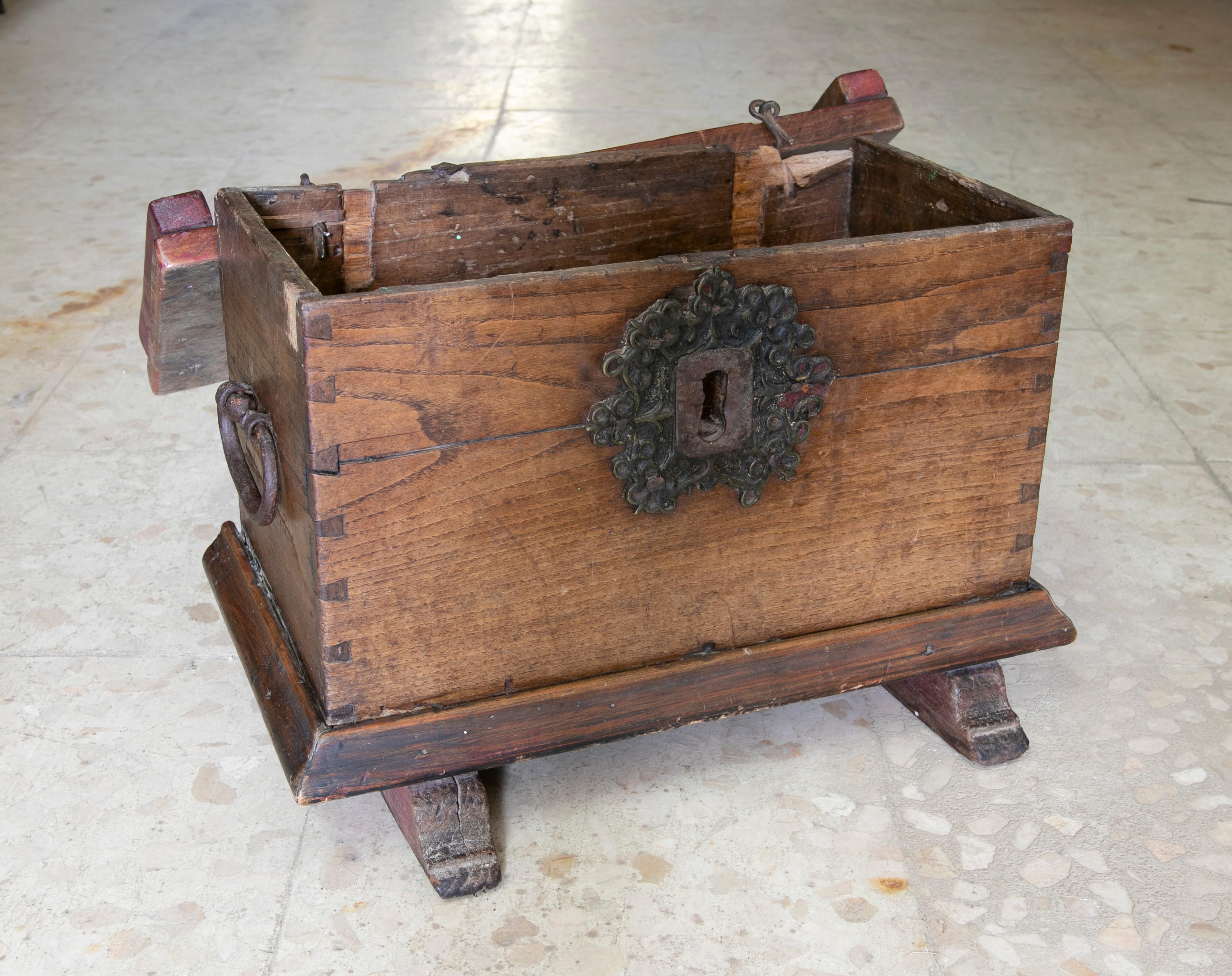 Spanish wooden chest with original iron fittings.