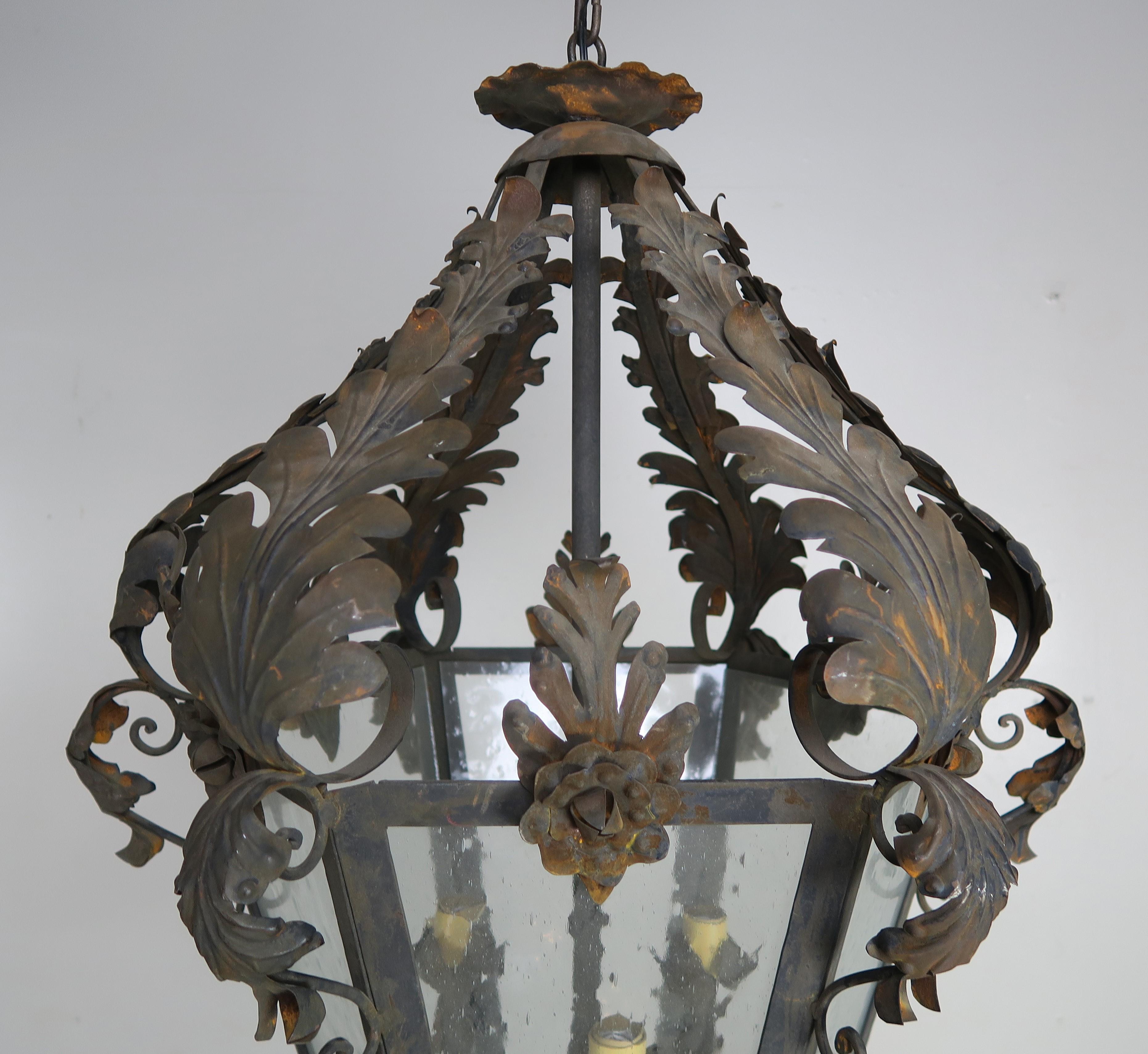 Spanish Wrought Iron and Reeded Glass Lantern, circa 1930s In Distressed Condition For Sale In Los Angeles, CA