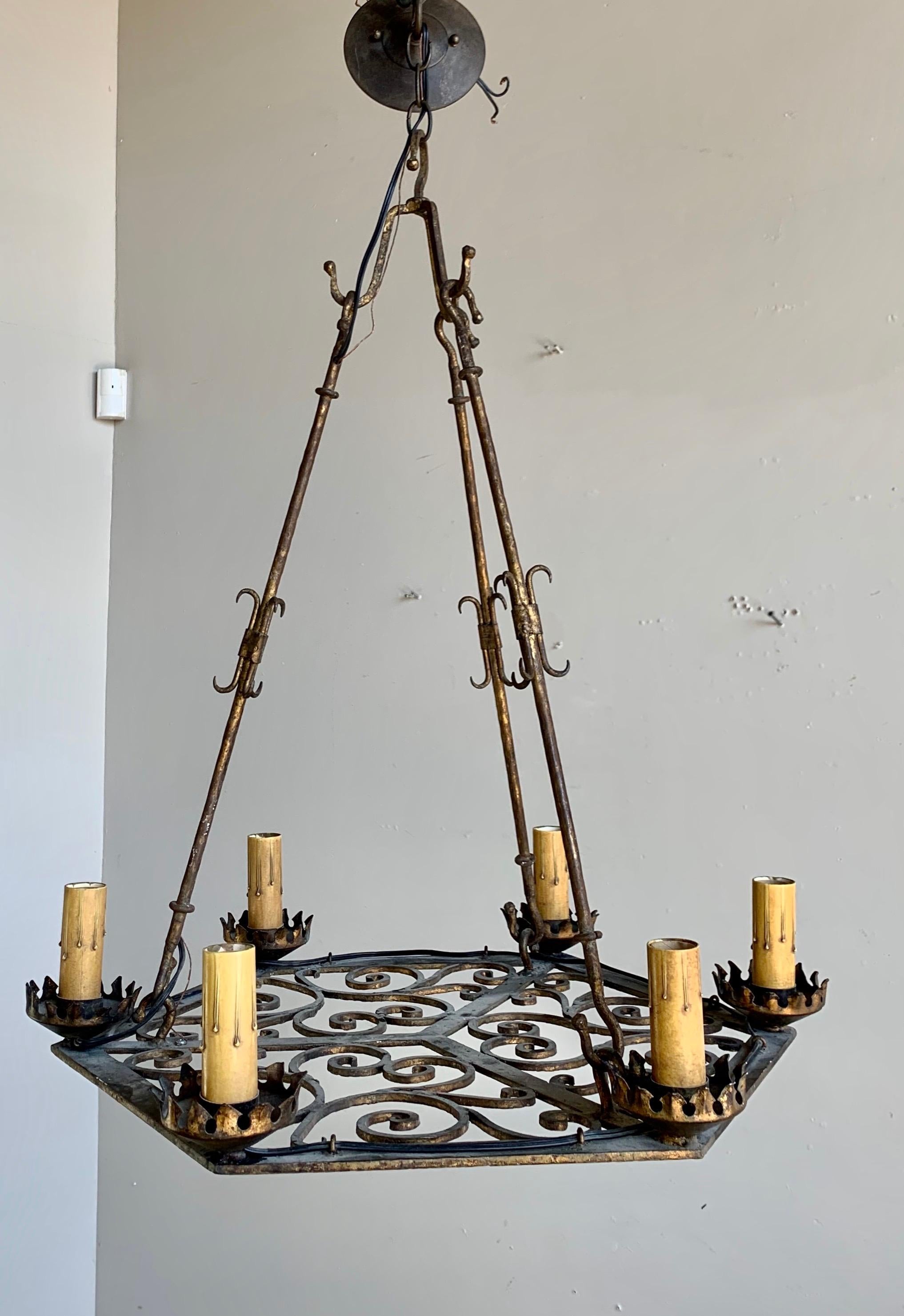 (6) light Spanish handwrought iron chandelier. The fixture is rewired and include chain and canopy.