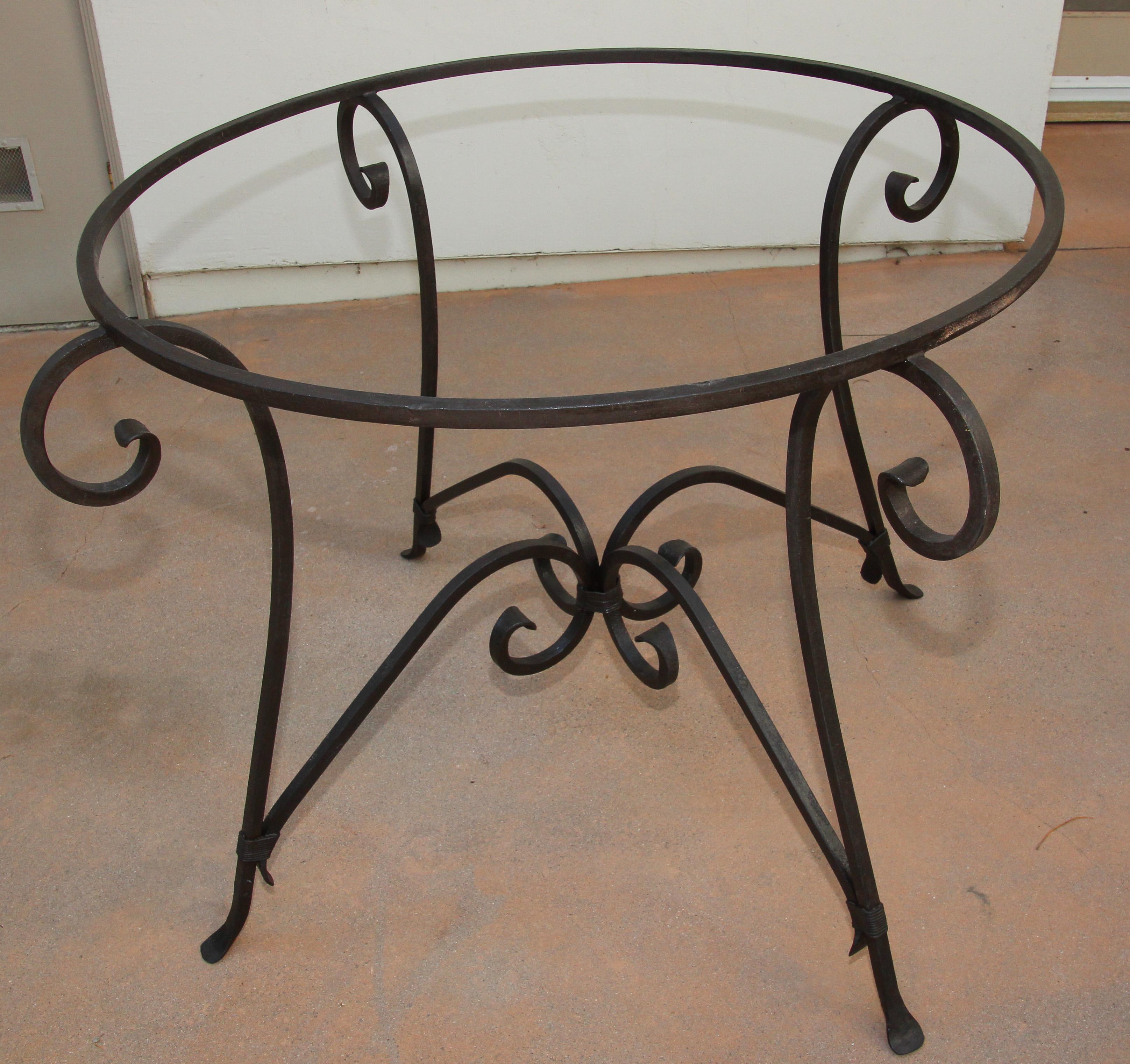 Hand forged Spanish iron base with curved legs, scrolls wrought iron dining table pedestal.
Could be use indoor or outdoor.
Vintage Spanish Moorish style wrought iron base.
Listing is for the base only and does not include a glass top, could be used