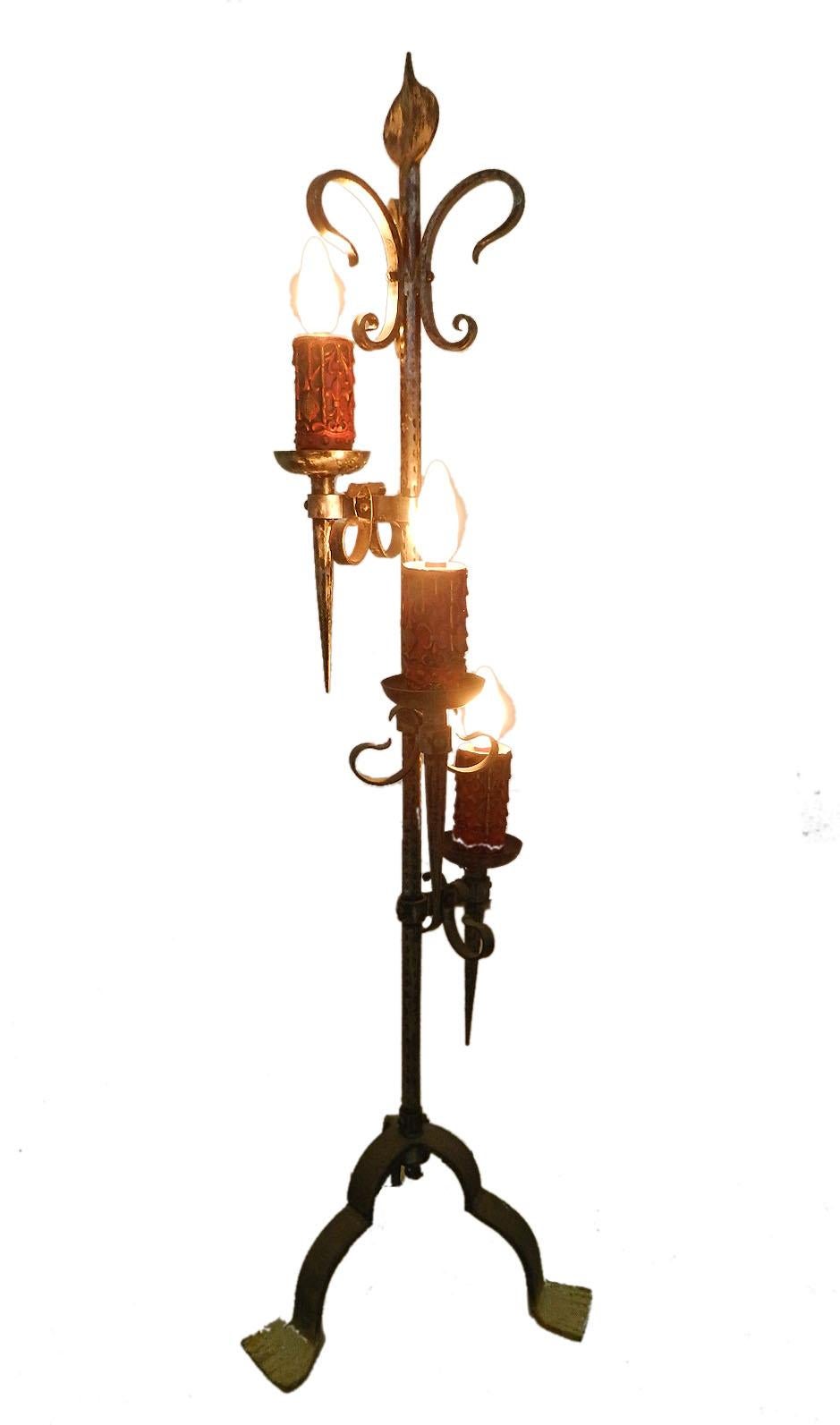 Spanish floor lamp circa 1960 artisan made wrought iron one of a Kind
3 bulb lights with large faux candle sleeves
Hammered Iron
This can be re-wired and tested to USA or European and UK standards.