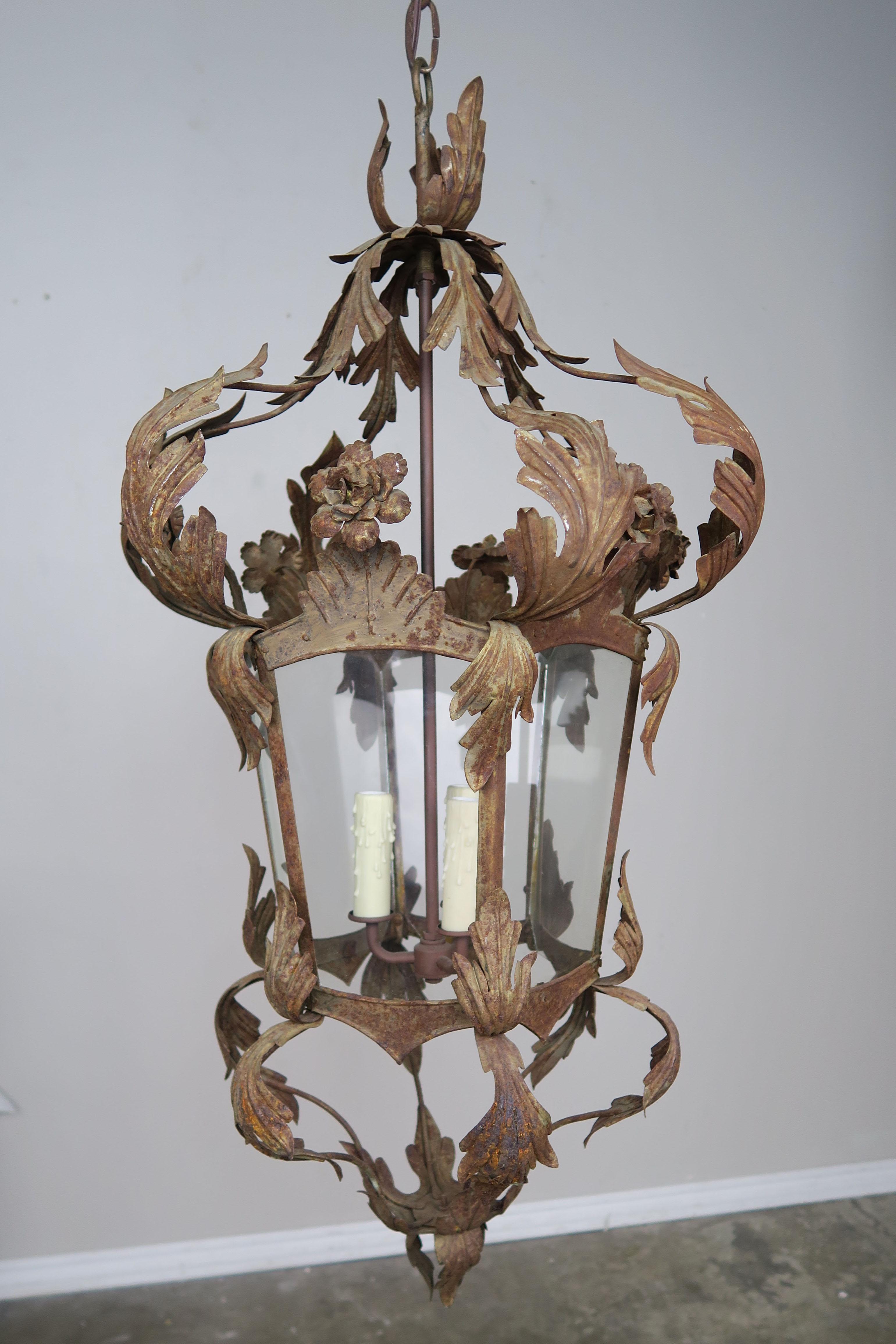 Large Spanish hand forged wrought iron lantern with acanthus leaf detailing throughout. The fixture has been newly rewired and includes chain and canopy. Ready to install.