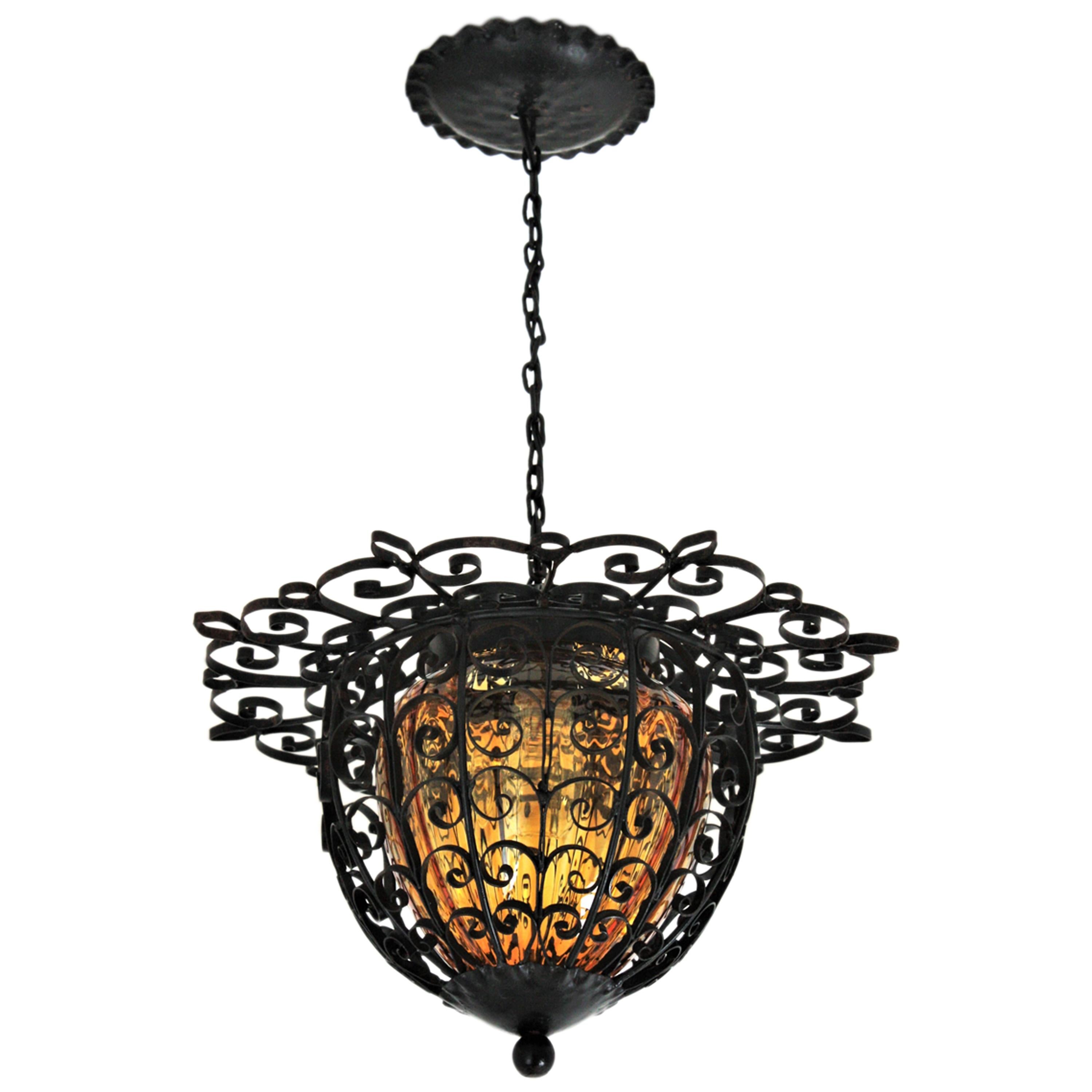 Spanish Lantern Pendant Light in Wrought Iron with Amber Blown Glass Shade