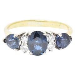 Spark 1.25 Carat Sapphire and Diamond 18 Karat Gold Ring, circa 1980s