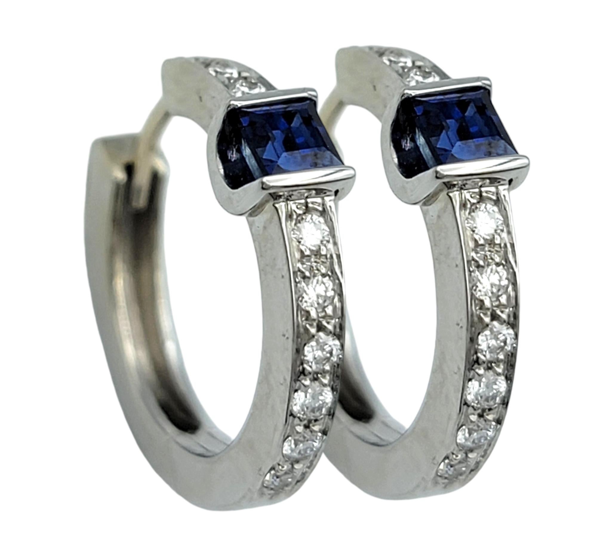 Indulge in the modern elegance of these exquisite hoops by Spark Creations, a designer renowned for crafting jewelry that transcends trends. These stunning earrings are a celebration of luxury, featuring a pair of vibrant square-cut blue sapphires,