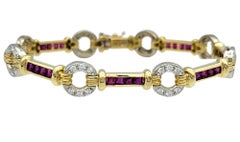 Spark Creations Pulsera de eslabones con estación de rubíes y diamantes en oro amarillo de 18 quilates