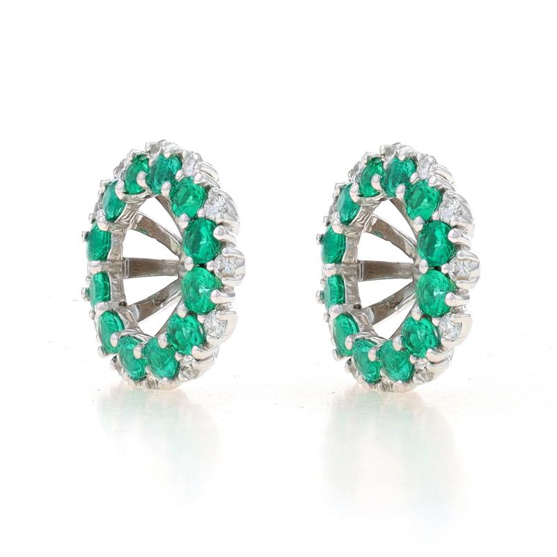 Brand: Spark

Metal Content: 18k White Gold

Stone Information
Natural Emeralds
Treatment: Oiling
Carat(s): .75ctw
Cut: Round
Color: Green

Natural Diamonds
Carat(s): .14ctw
Cut: Round Brilliant
Color: E - F
Clarity: VS1 - VS2

Total Carats:
