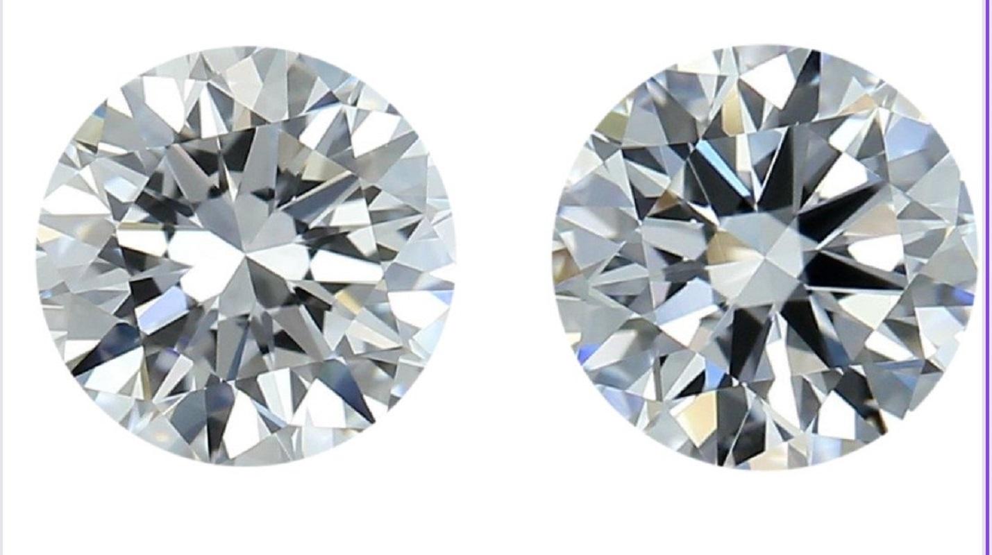 A pair of sparkling natural round brilliant diamonds in a 2-carat D IF with beautiful and very good cut. This diamond comes with IGI Certificate and laser inscription number.

SKU: E-206 & E-205
IGI 557255277 & 557255274