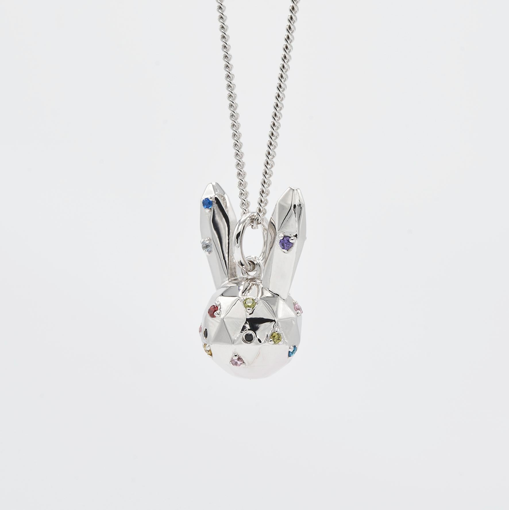 Bunny with rainbow cubic zirconia and design-cut shape.

Dimensions:
19mm x 12mm, chain 45cm + extender            
Composition: 
Sterling Silver / cubic zirconia

Sold with chain