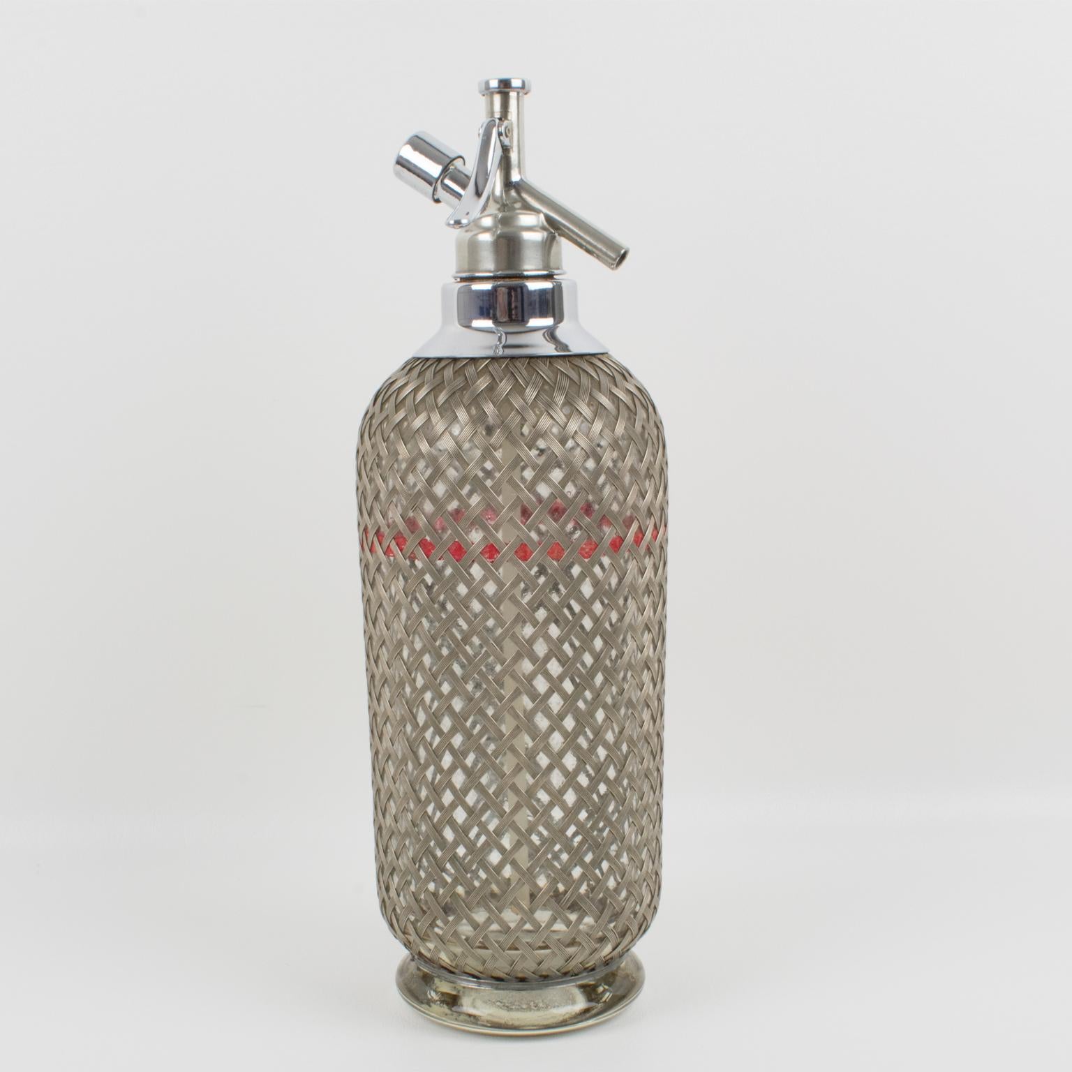 An original soda (Seltzer water) siphon glass bottle with metal wicker wire mesh protection by Sparklets Ltd, London. Featuring the pre-war European cocktail culture, those bottles, mainly used in cafes and restaurants once came in a variety of